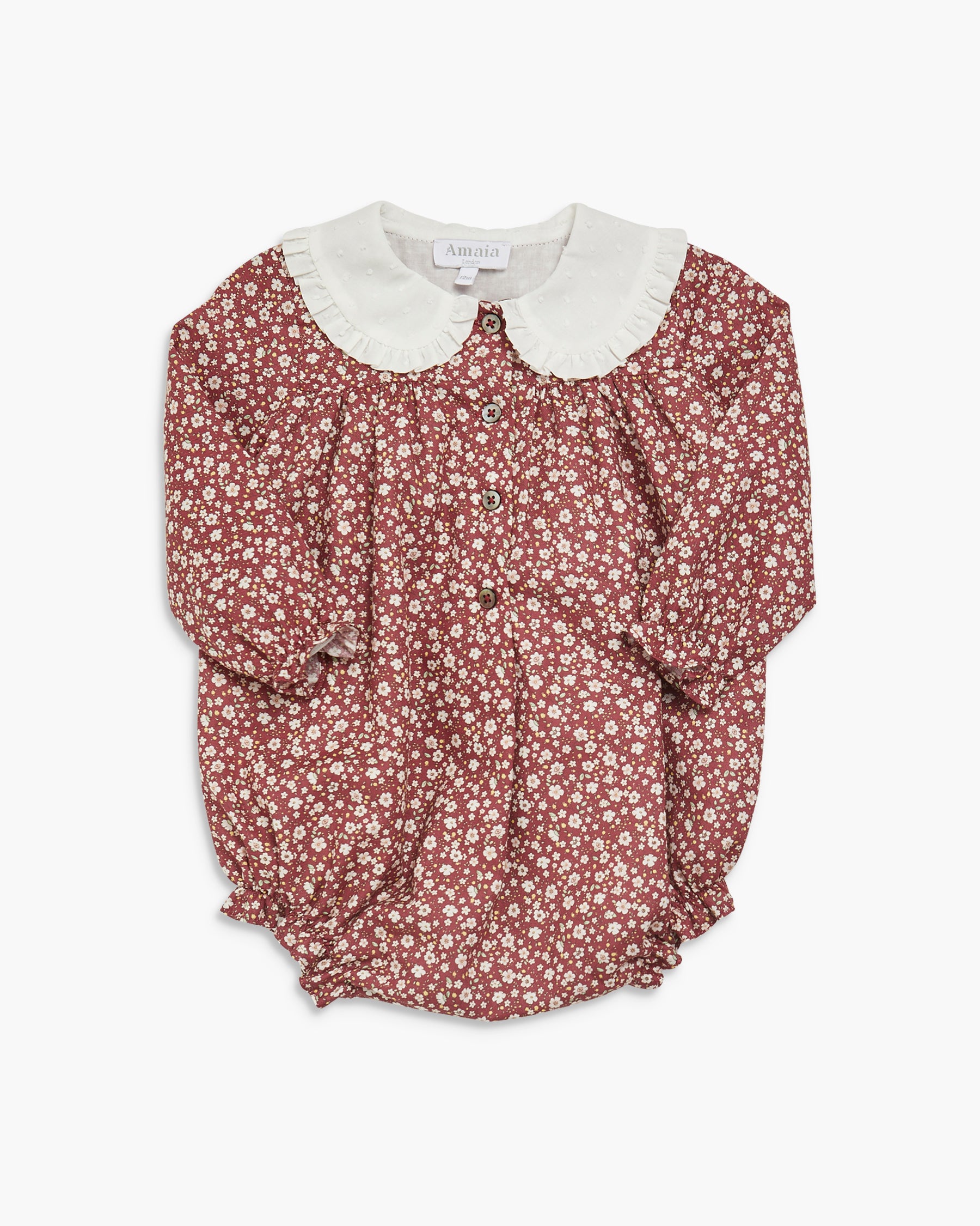 Floral blouse with a white collar on a white background
