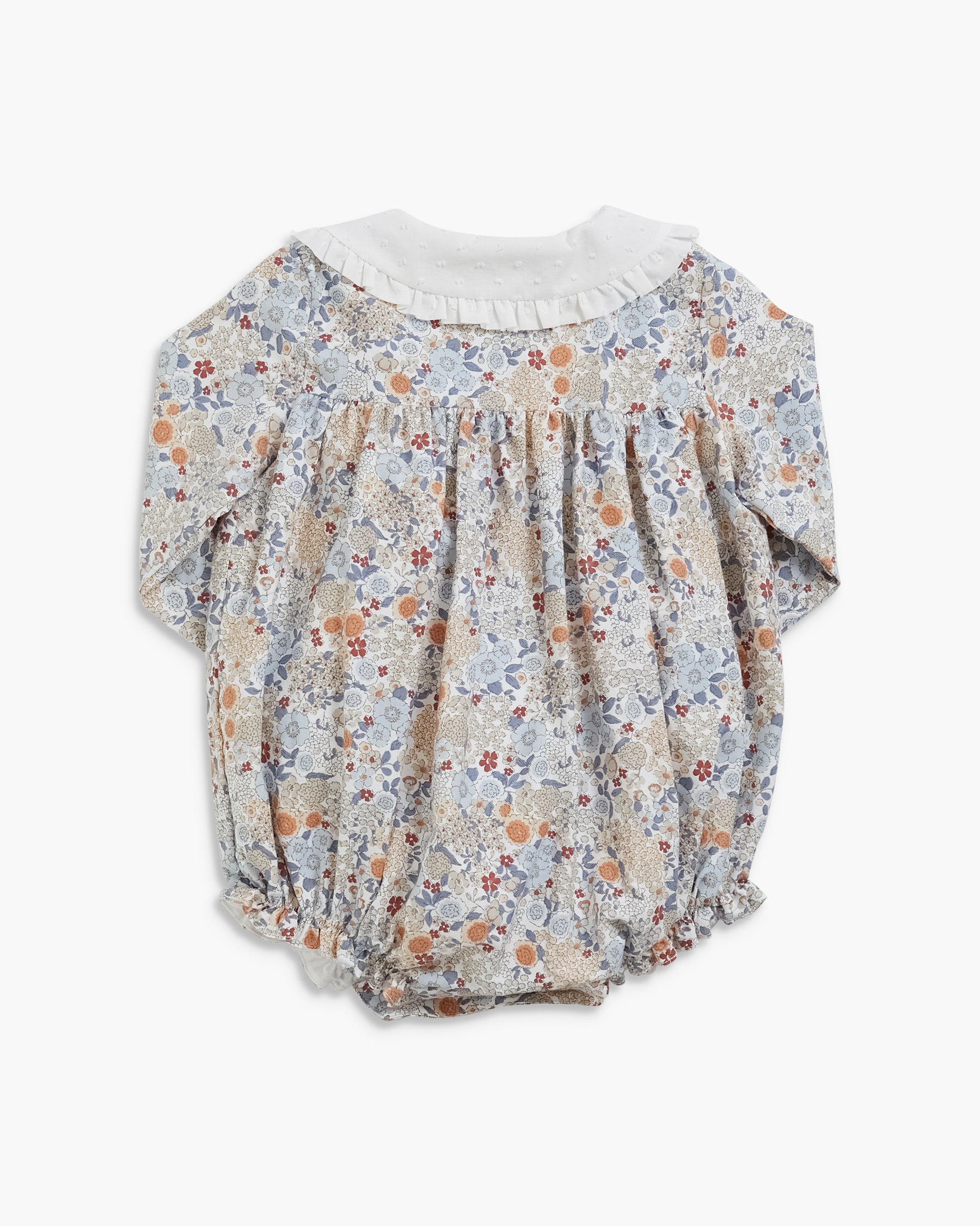 A baby girl's long-sleeve bloomers romper featuring a delicate multicolor floral print on a light beige background, with a contrasting white ruffled collar.