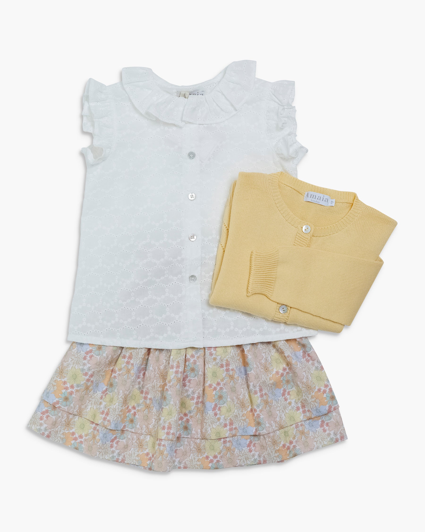 white blouse and floral skirt with matching cardigan