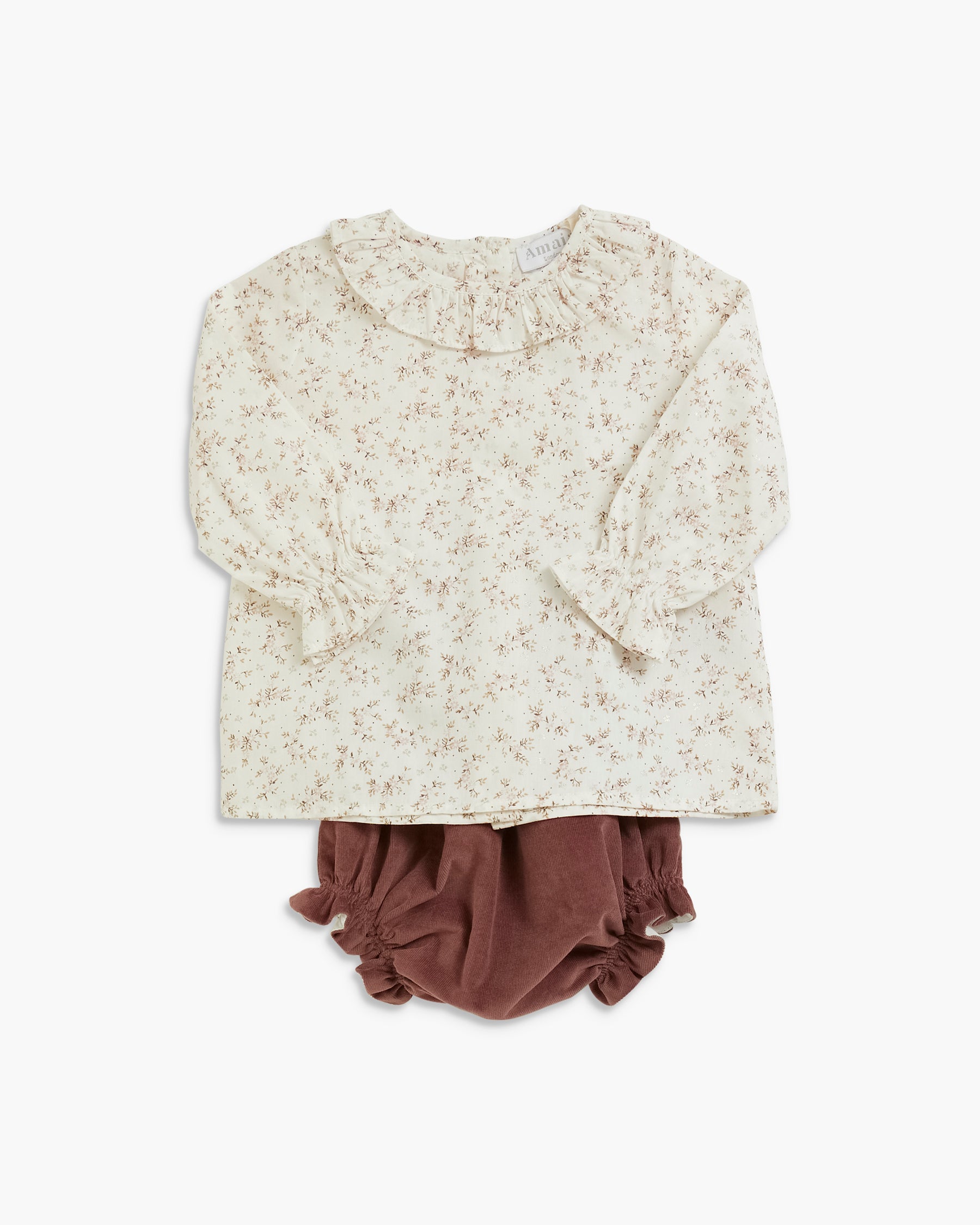 A toddler girl's two-piece outfit featuring a cream-colored long-sleeve blouse with a delicate brown floral print and ruffled collar, paired with brown ruffled bloomers, laid flat on a white background.
