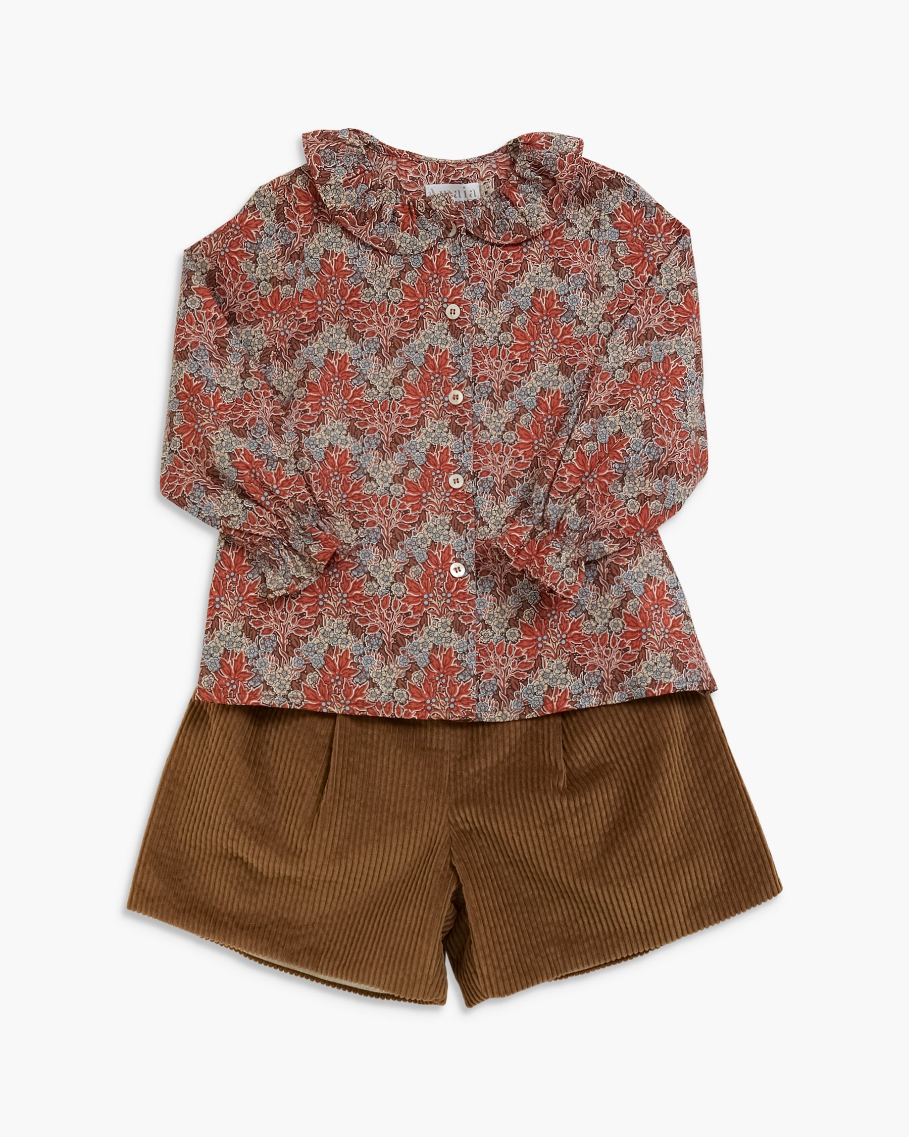 A children's two-piece outfit featuring a long-sleeve button-up shirt with a rust-red and gray floral pattern, paired with brown corduroy shorts, laid flat against a light gray background.