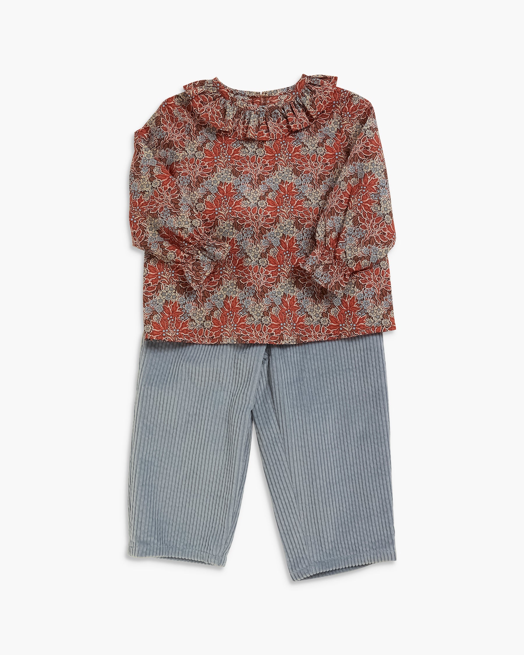 A toddler girl's two-piece outfit featuring a long-sleeve top with a rust-red and gray damask pattern and ruffled neckline, paired with light blue-gray vertically striped pants, shown on a plain white background.