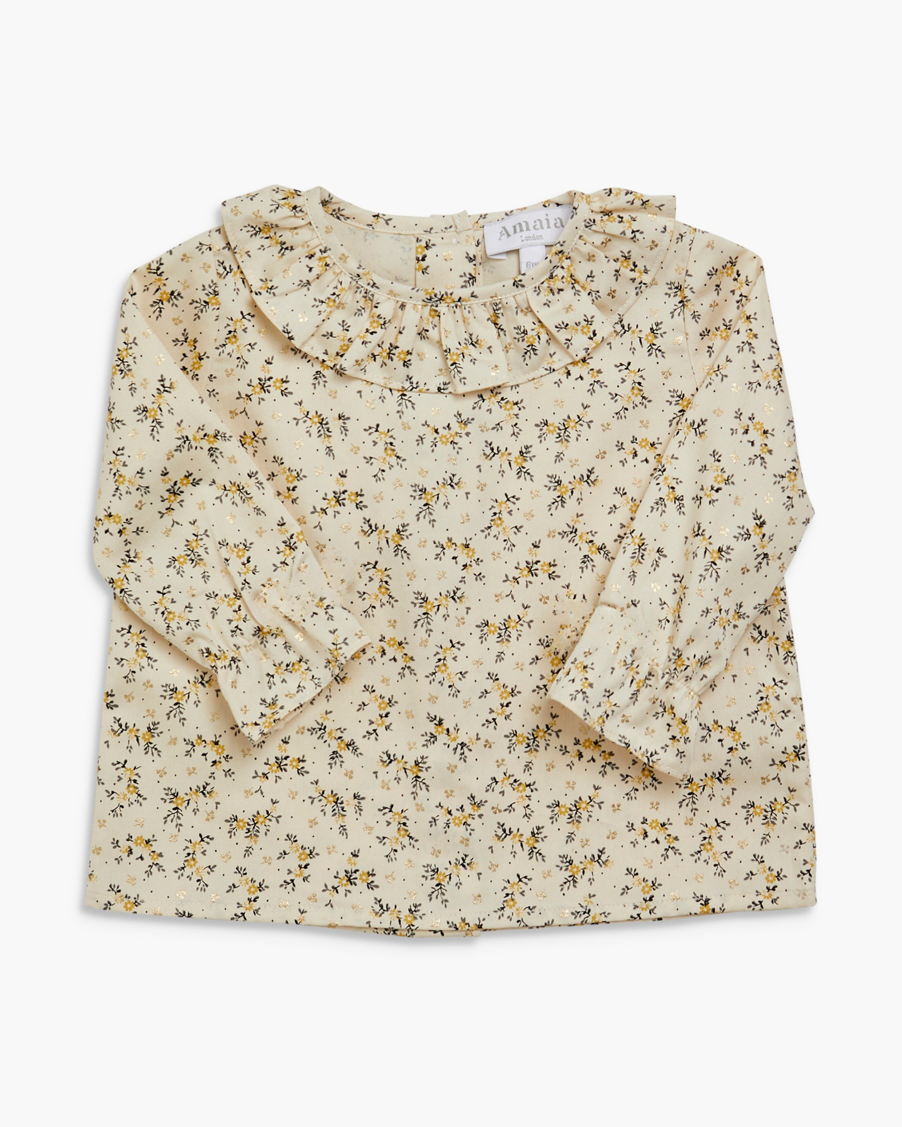 Floral blouse with ruffled collar on a white background