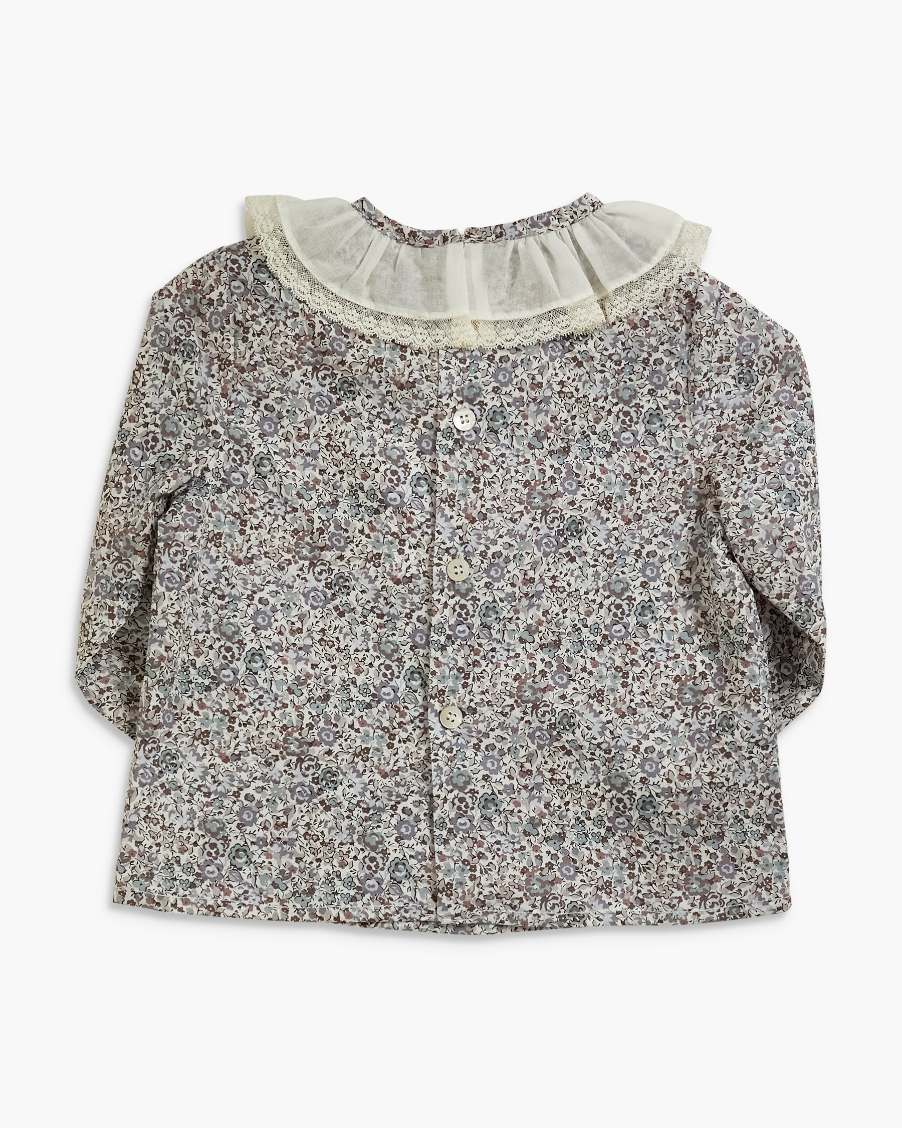 A long-sleeve baby cardigan featuring a dense small floral print in gray, beige, and white, with a contrasting wide white ruffled collar and a buttoned front.