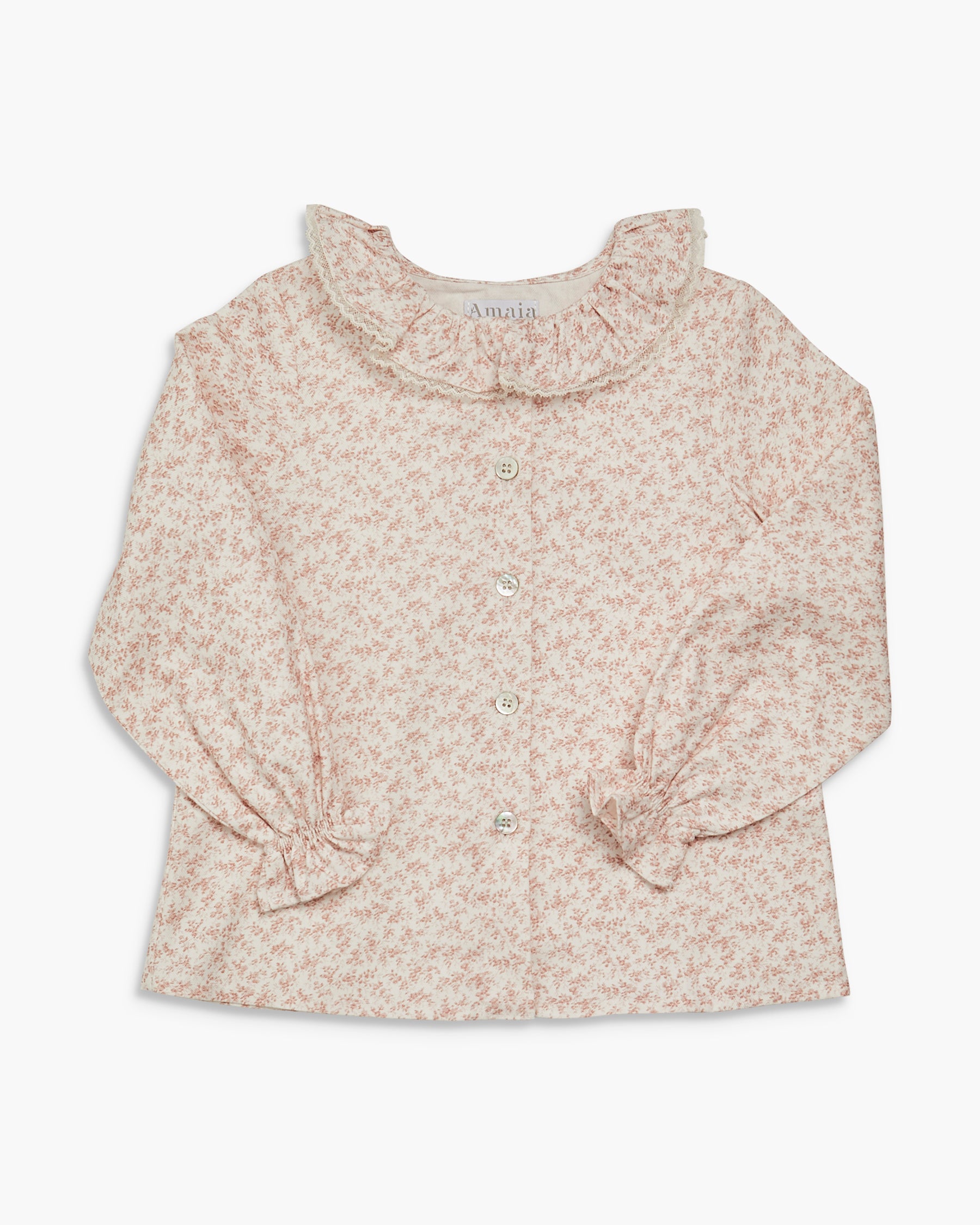 Floral blouse with ruffled collar on a white background