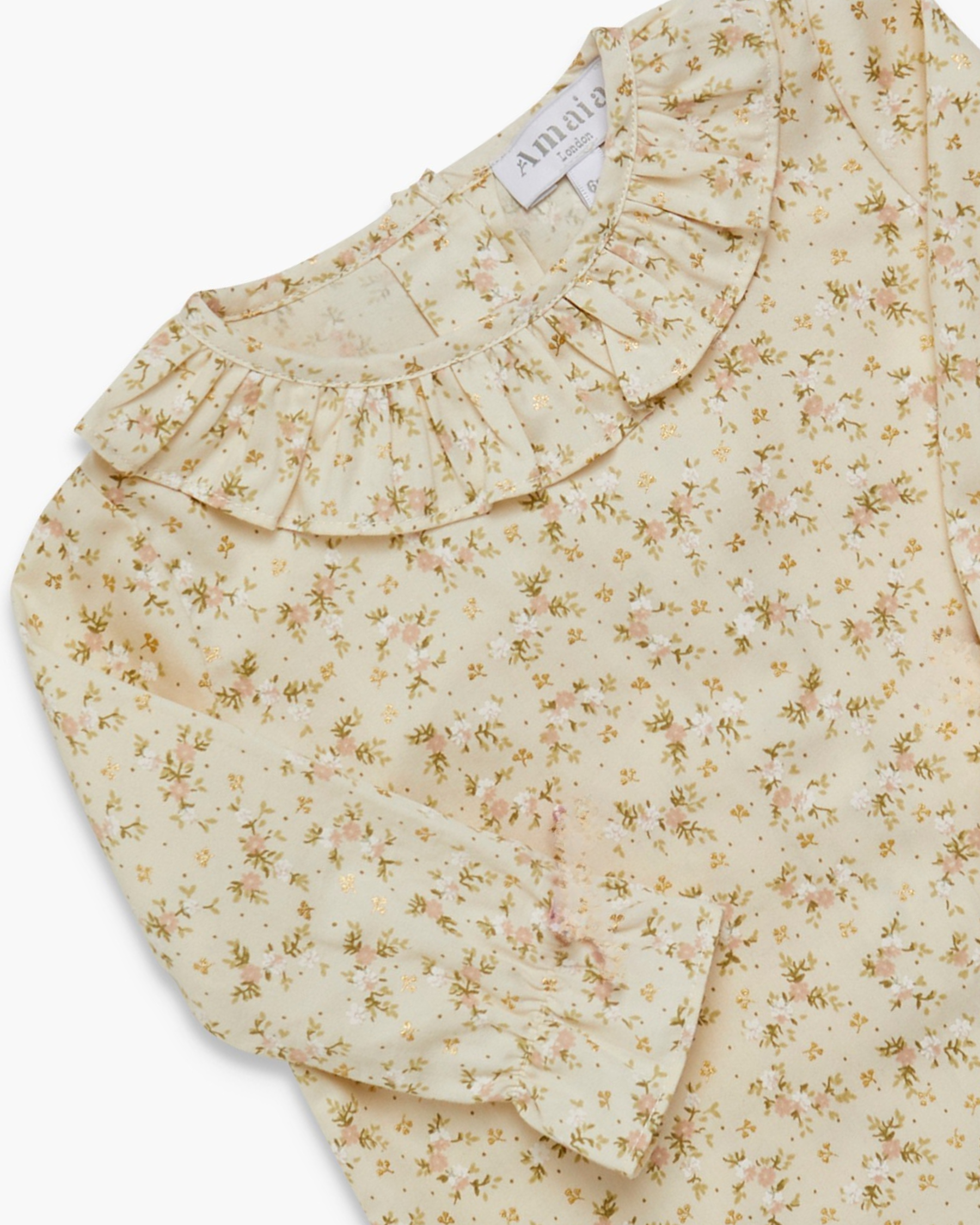 Floral blouse with ruffled sleeves on a white background