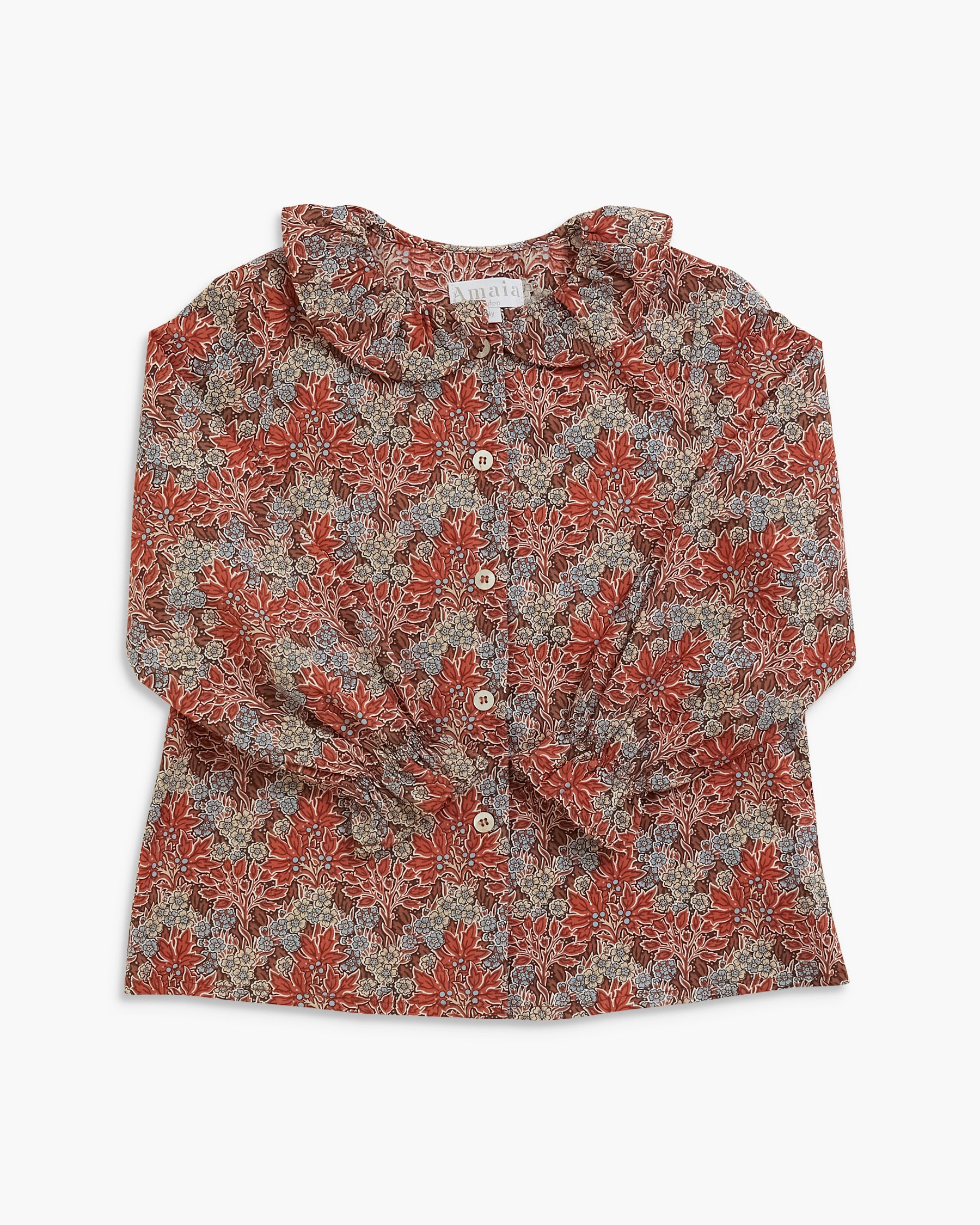 A long-sleeve button-up blouse with a ruffled Peter Pan collar, featuring an all-over floral pattern in rust red and beige on a light gray background.
