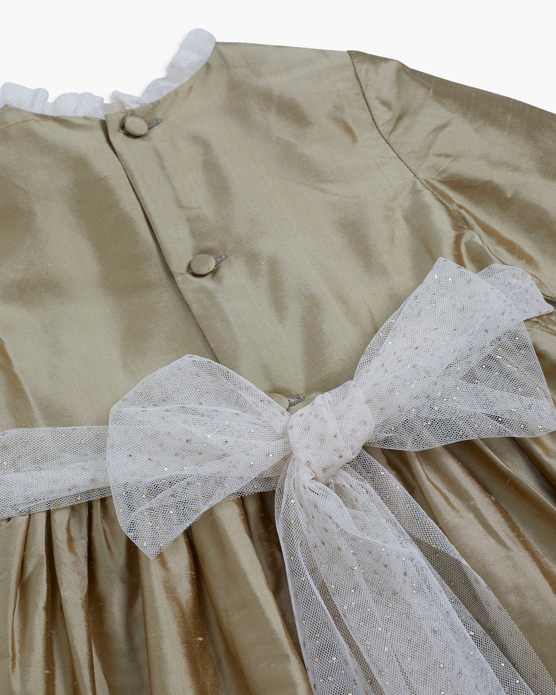 Beige dress with a large white bow on a white background