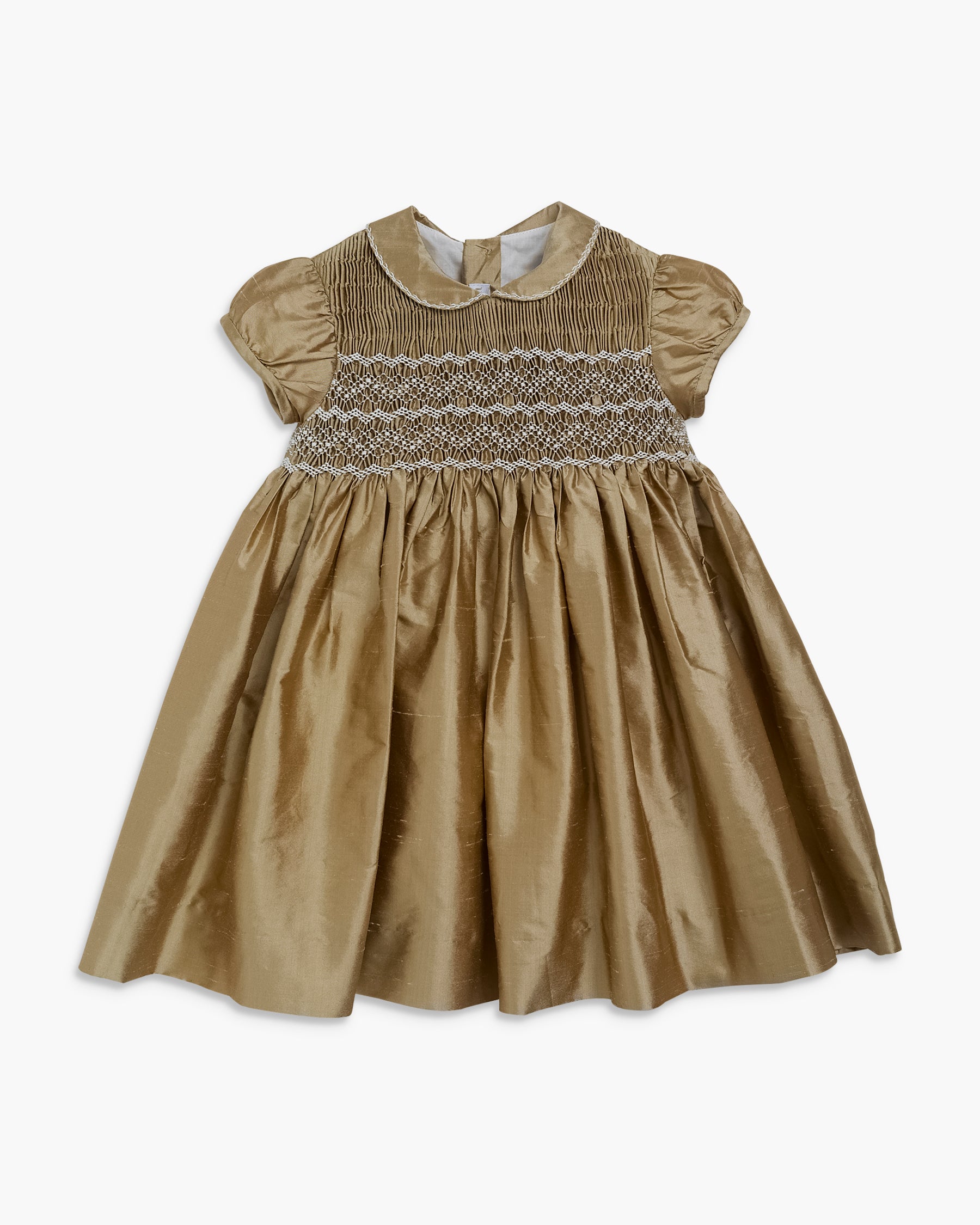 Brown dress with smocked bodice on a white background