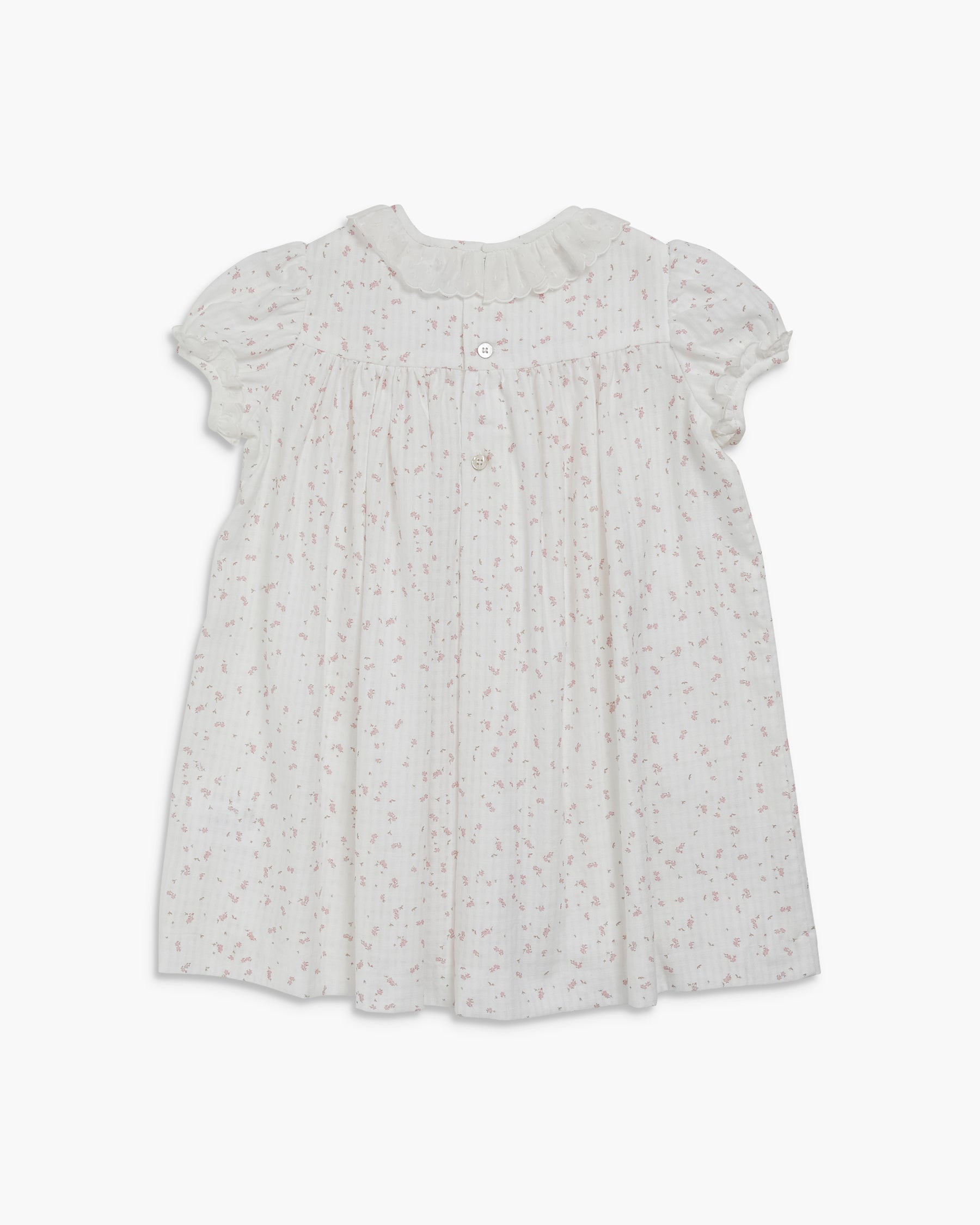 White dress with subtle pattern on a white background