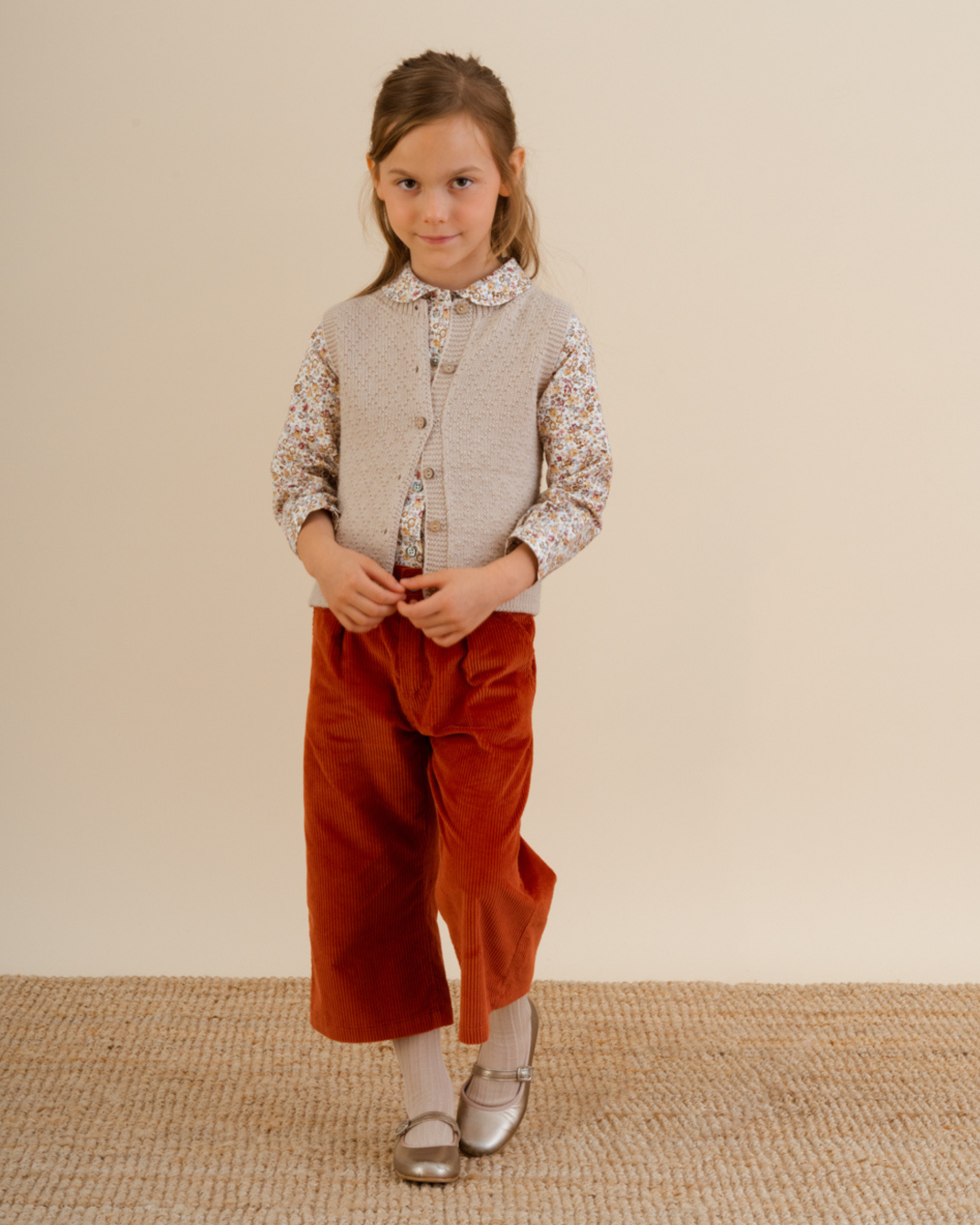 Girl wearing trousers Burnt Orange corduroy