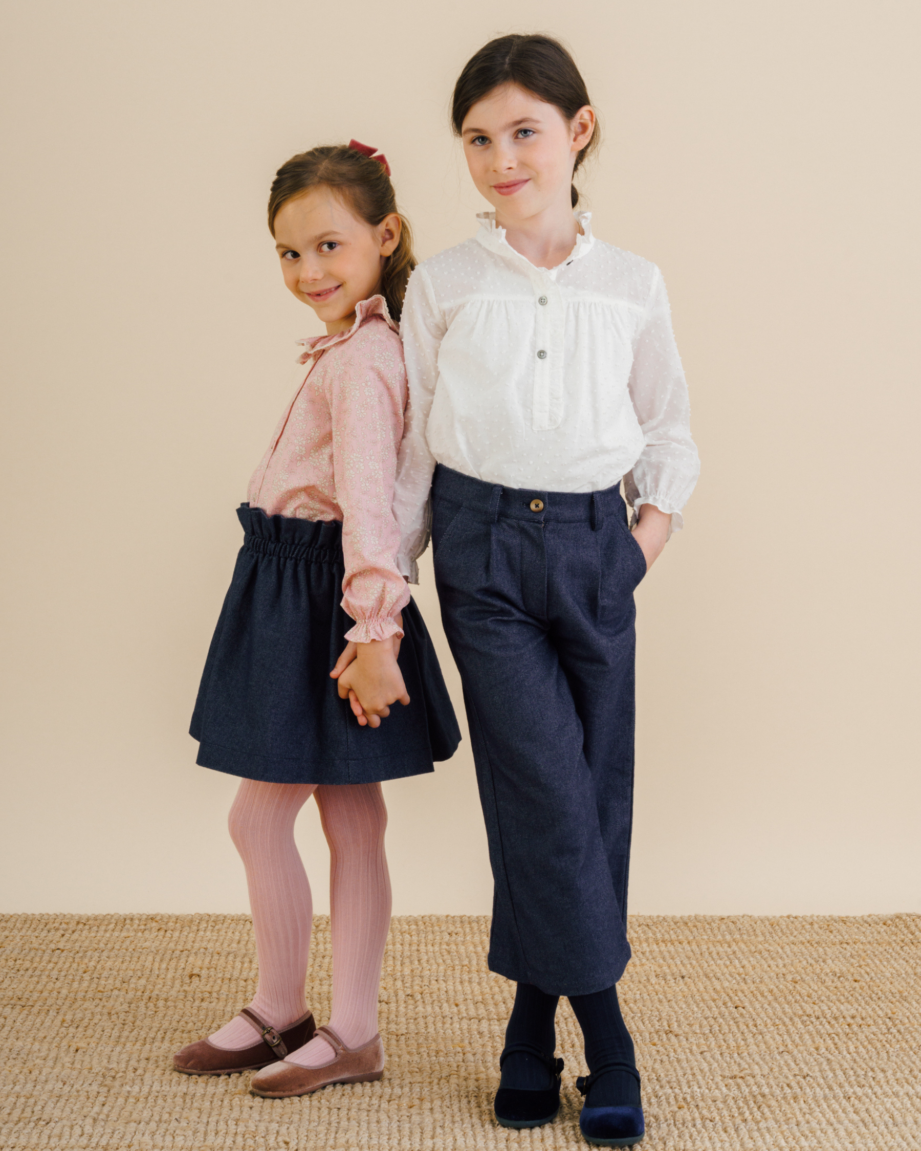 Girls wearing trousers or skirt in soft navy twill fabric with a blouse