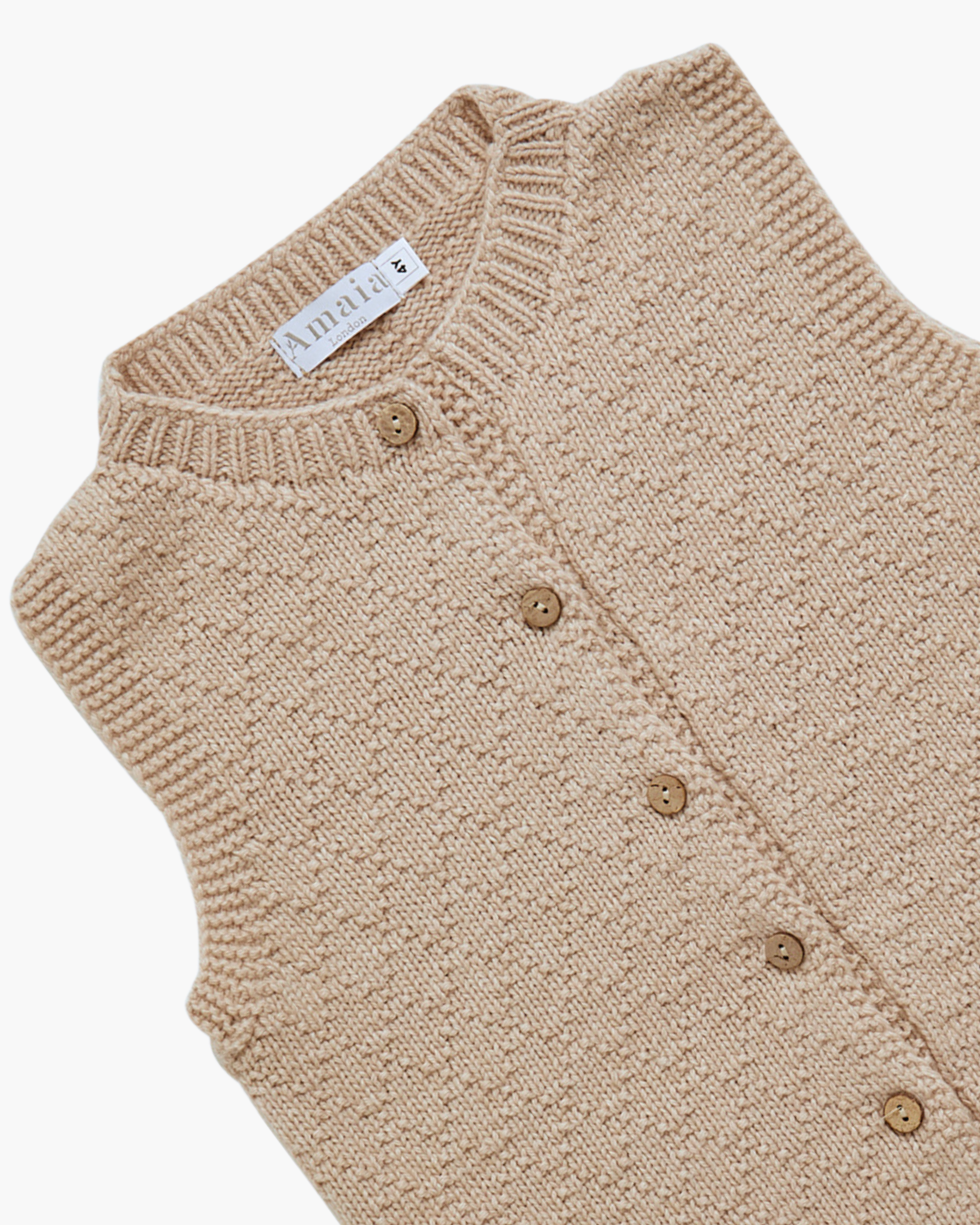 Beige sleeveless knit vest with buttons with button details