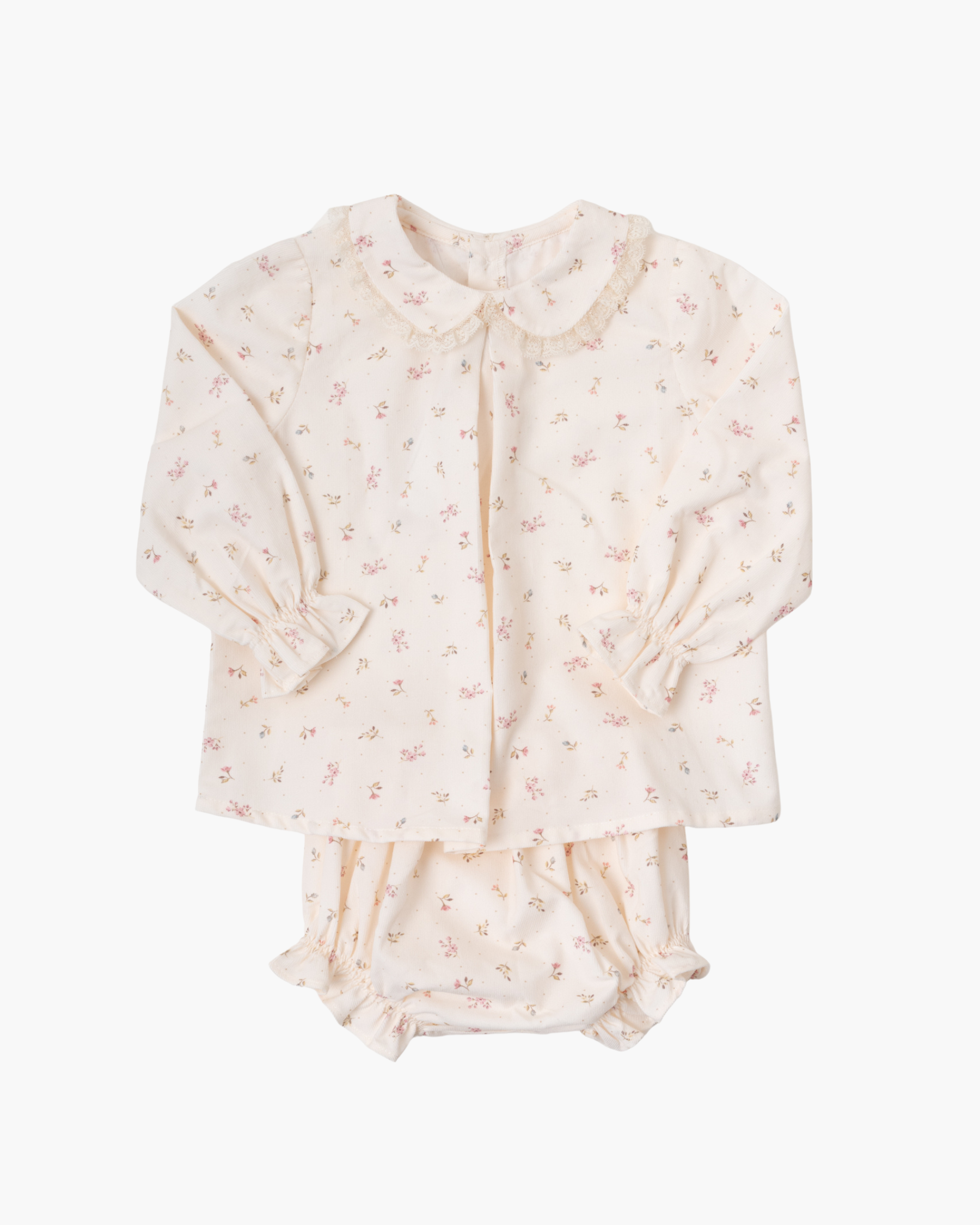 A two-piece baby outfit set featuring a long-sleeve blouse with a Peter Pan collar and matching ruffled bloomers, both in a cream-colored cotton fabric with a small pink floral print, shown on a plain white background.
