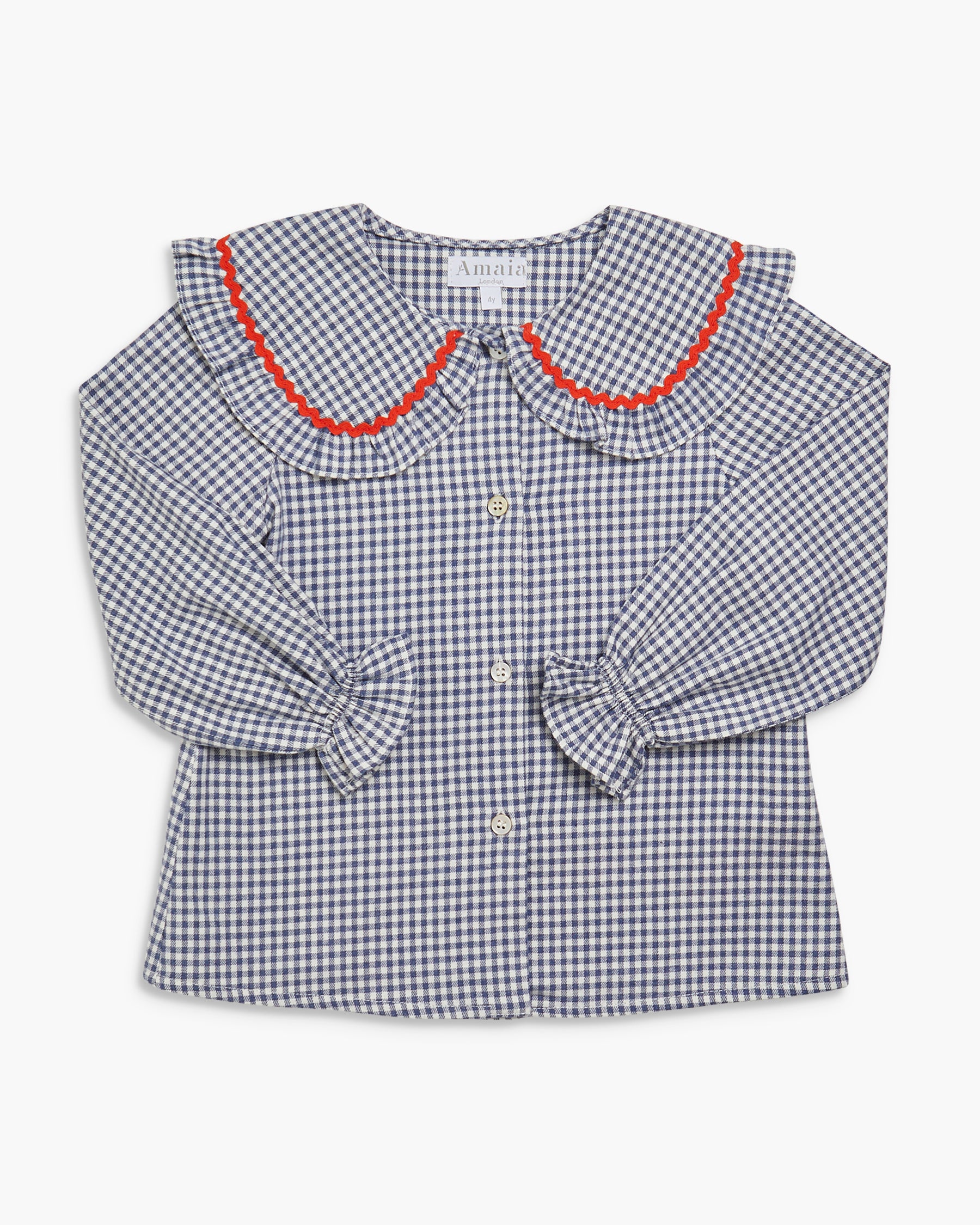 Checkered blouse with red trim on a white background