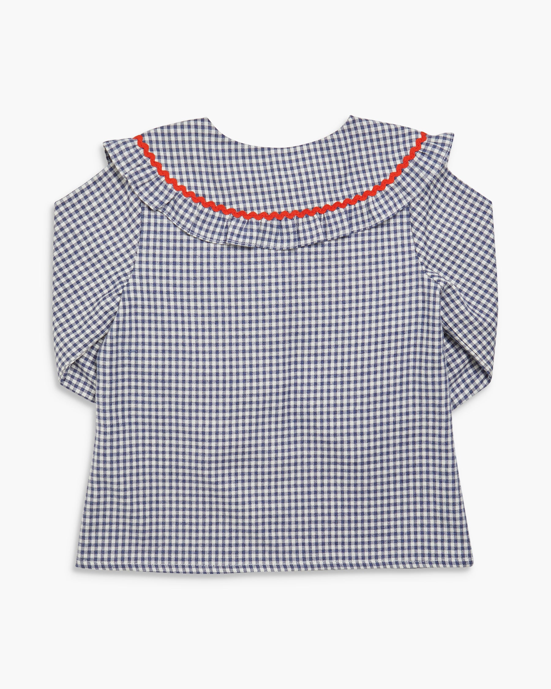 Black and white checkered blouse with red trim on a white background
