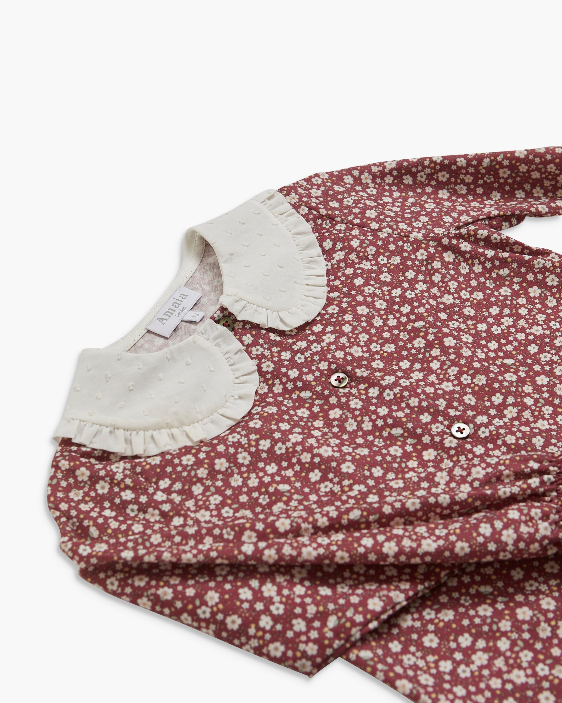 Floral dress with white collar on a white background