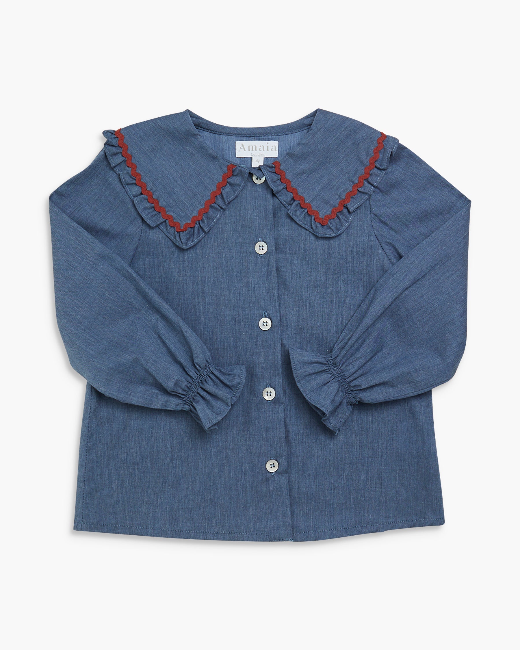 Blue blouse with red trim on a white background