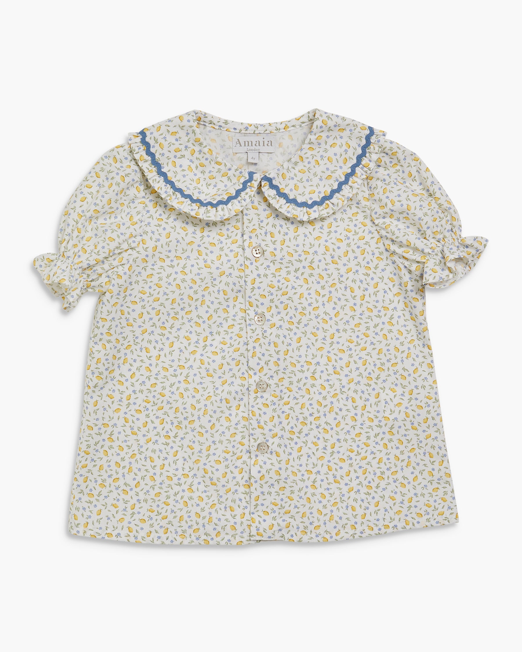 Floral blouse with ruffled collar on a white background