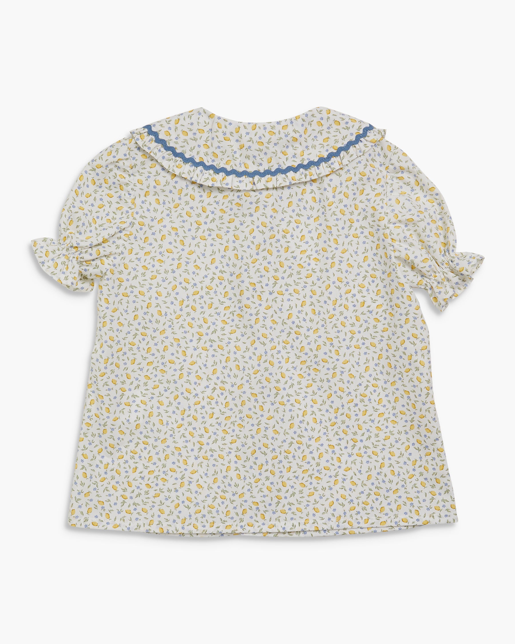 Floral blouse with ruffled sleeves on a white background