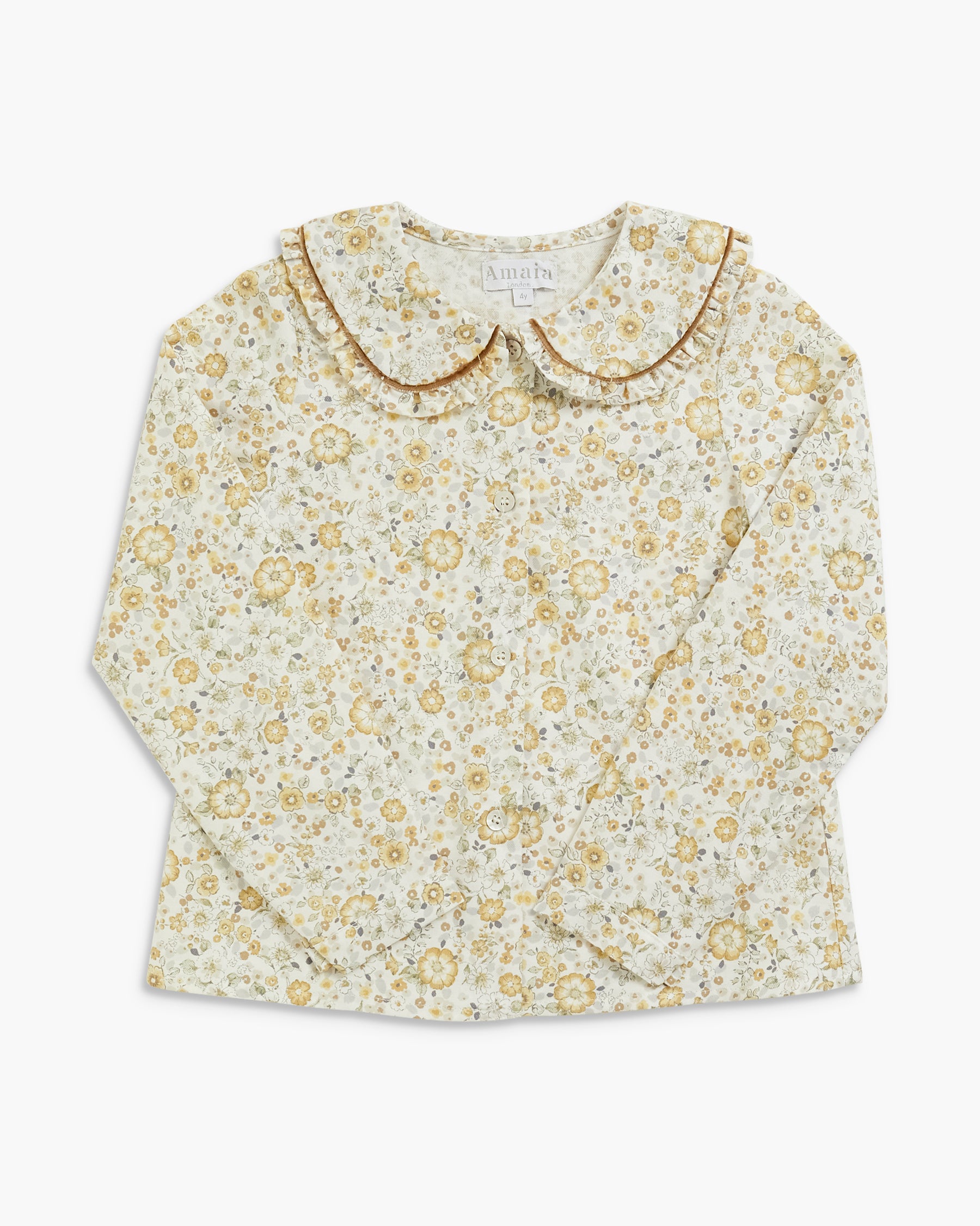 A long-sleeve babydoll blouse for toddlers, featuring a delicate yellow and green floral pattern on a cream background, with a ruffled collar trimmed in gold.