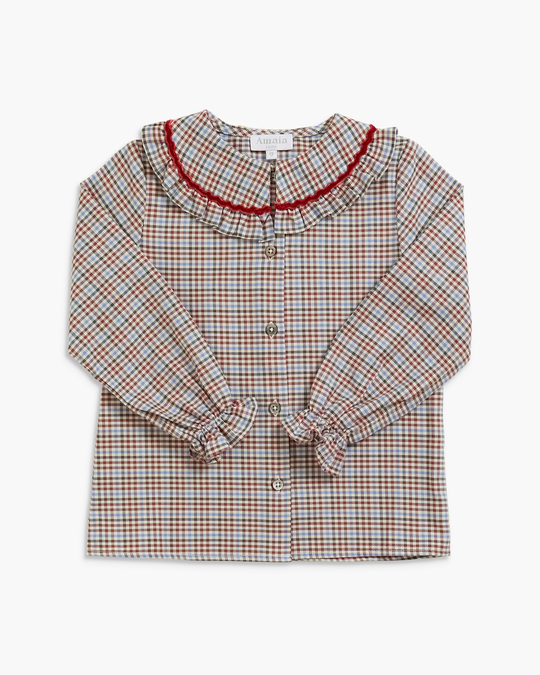 A long-sleeve button-up blouse for toddlers, featuring a brown and beige checkered pattern, a ruffled Peter Pan collar with red trim, and gathered cuffs.