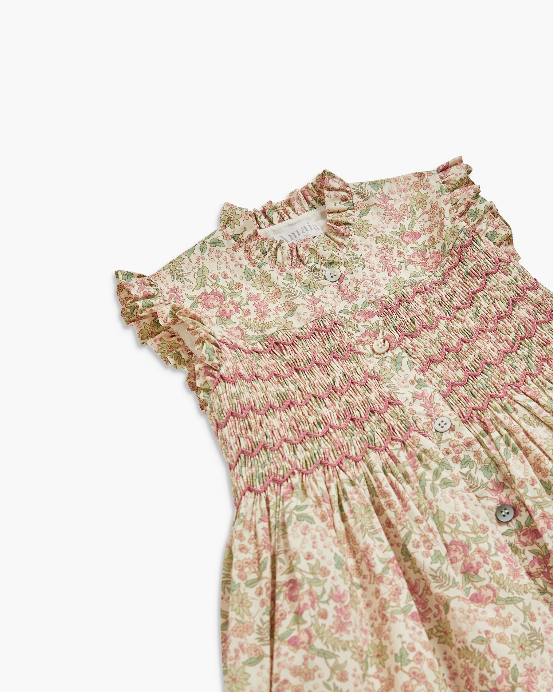 Floral dress with ruffled collar on a white background