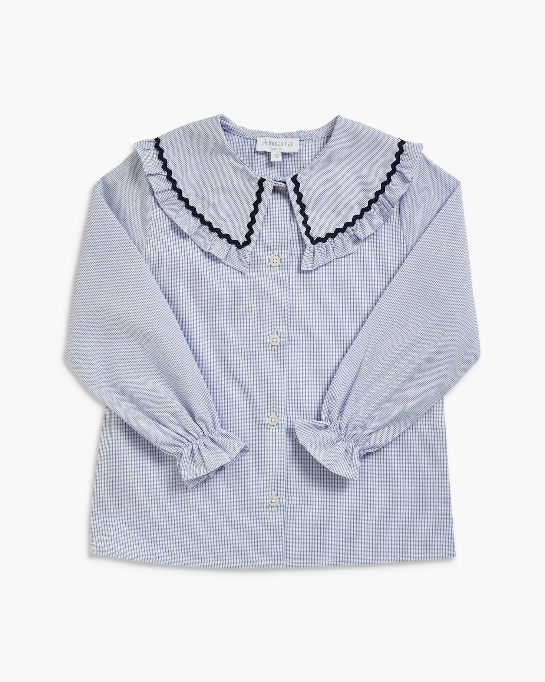 A light blue pinstriped long-sleeve blouse for girls, featuring a large ruffled collar with black scalloped trim, buttoned front, and gathered cuffs.