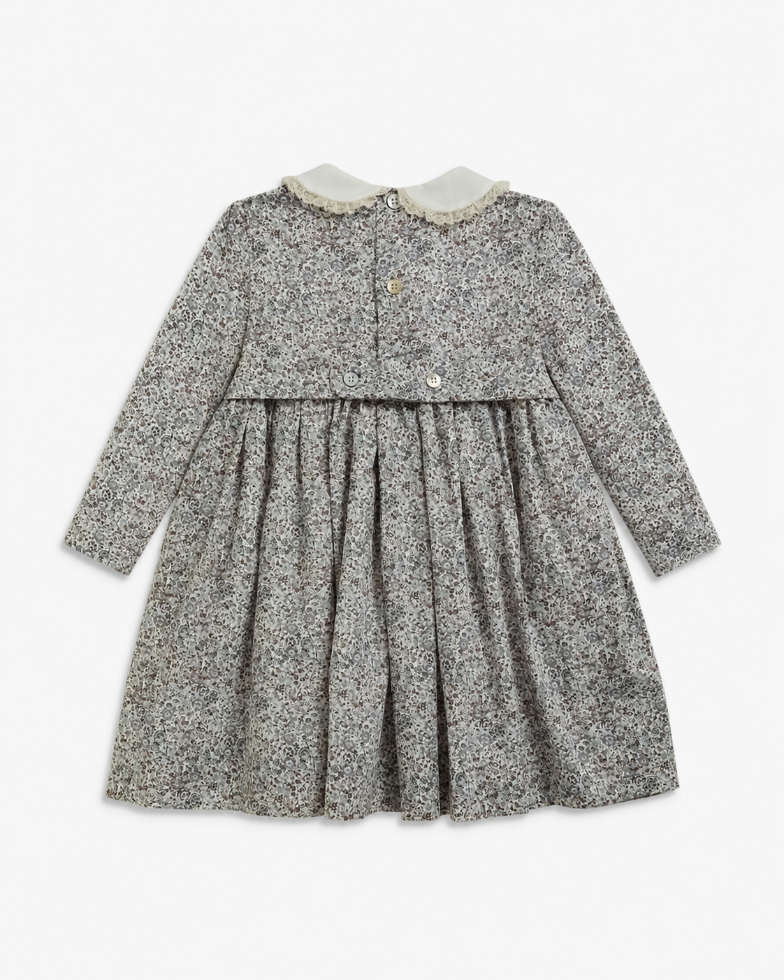 A long-sleeve baby dress with a gray and white floral print, featuring a Peter Pan collar with a cream-colored trim and a buttoned neckline.