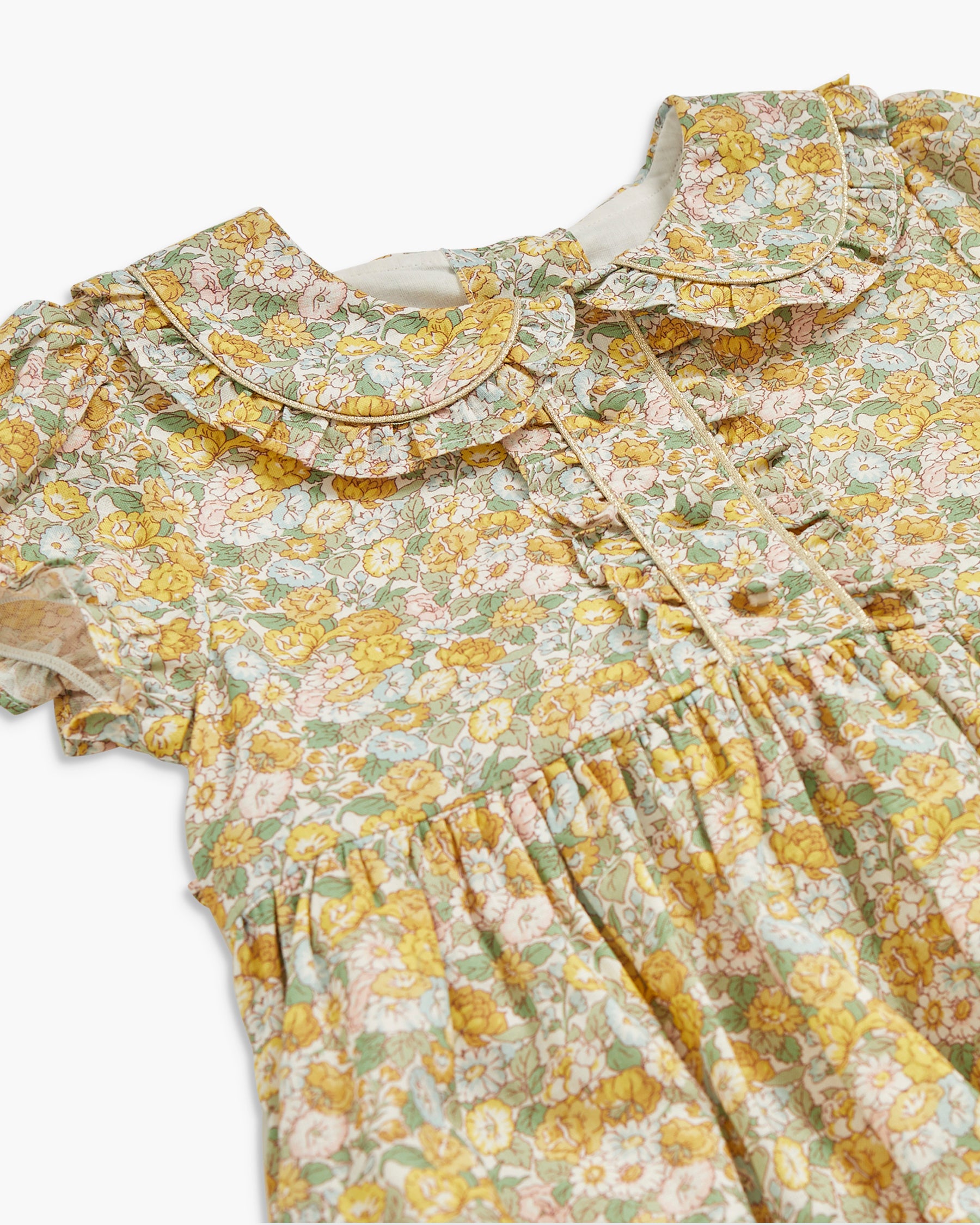 Floral dress with ruffled collar on a white background