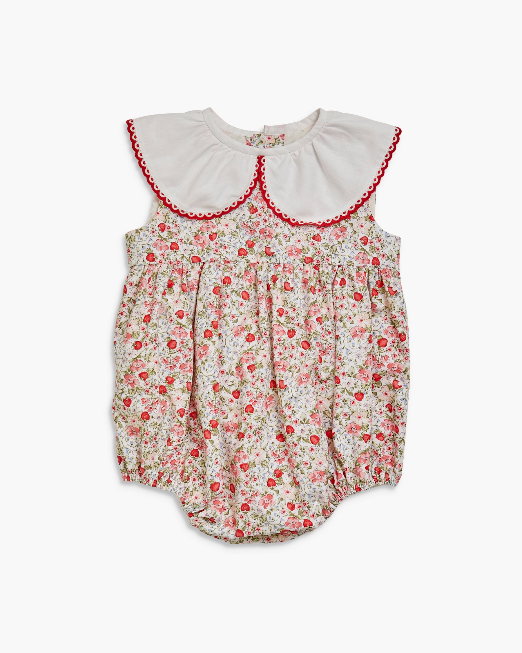 Floral baby romper with white collar on a white background