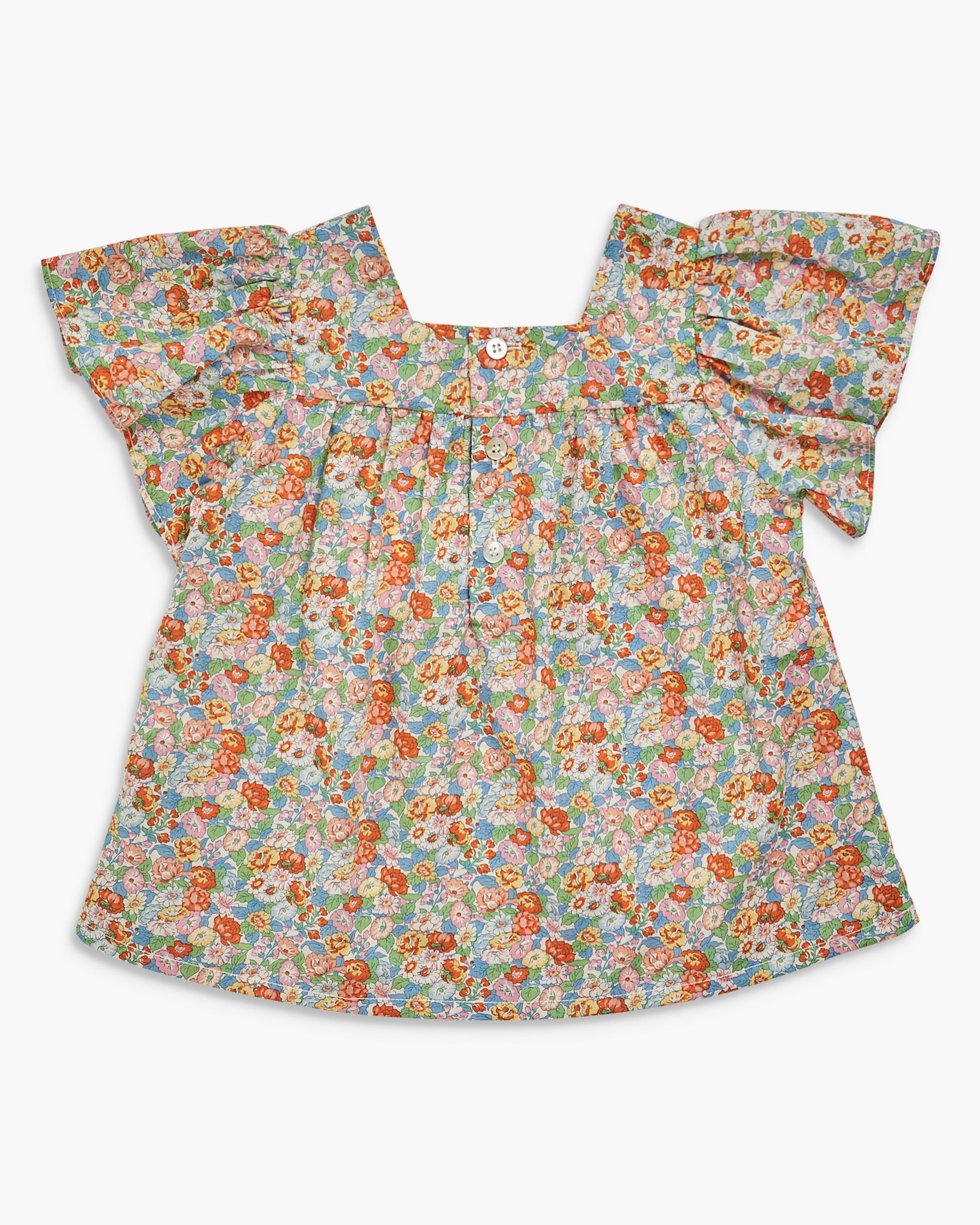 Floral blouse with ruffled sleeves on a white background