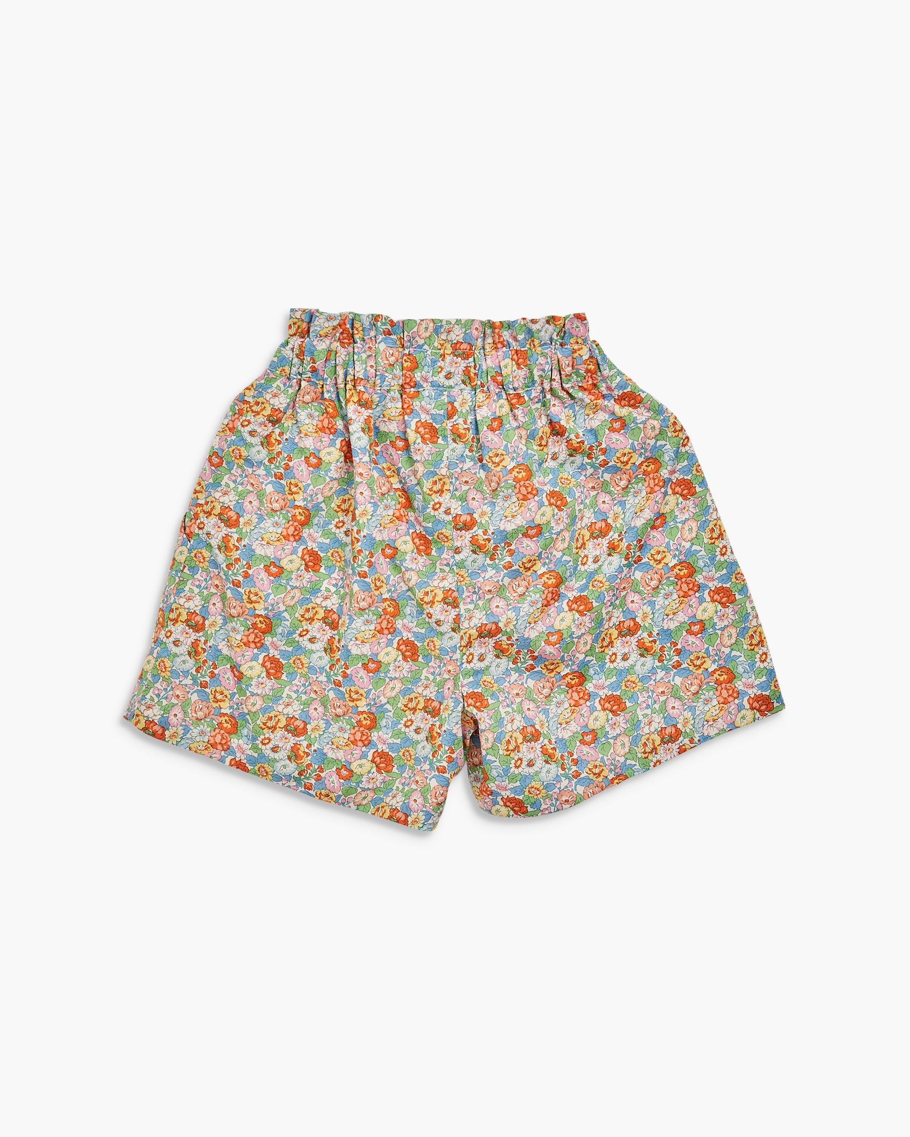 Floral patterned shorts on a white background