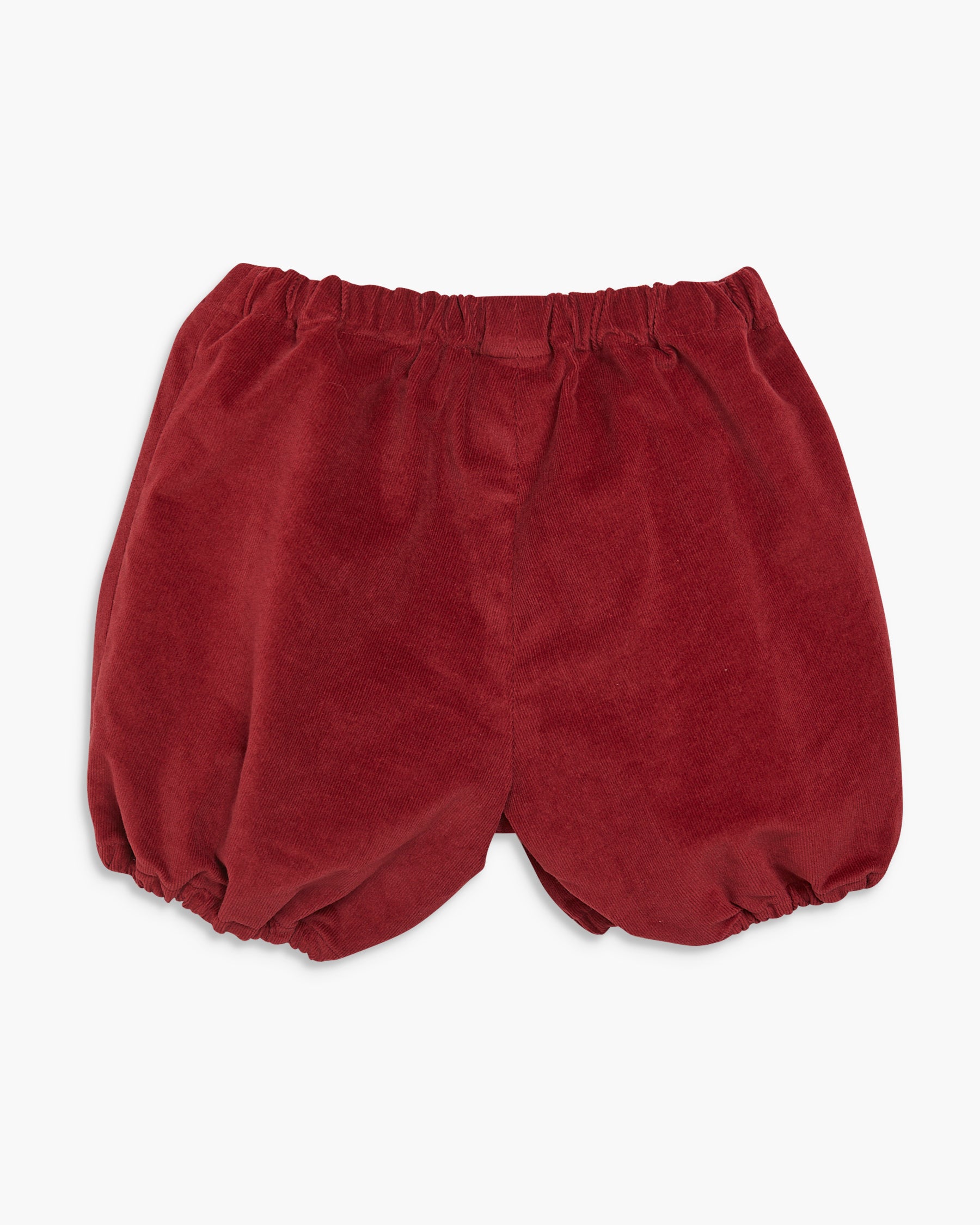 Red baby bloomers on a white background