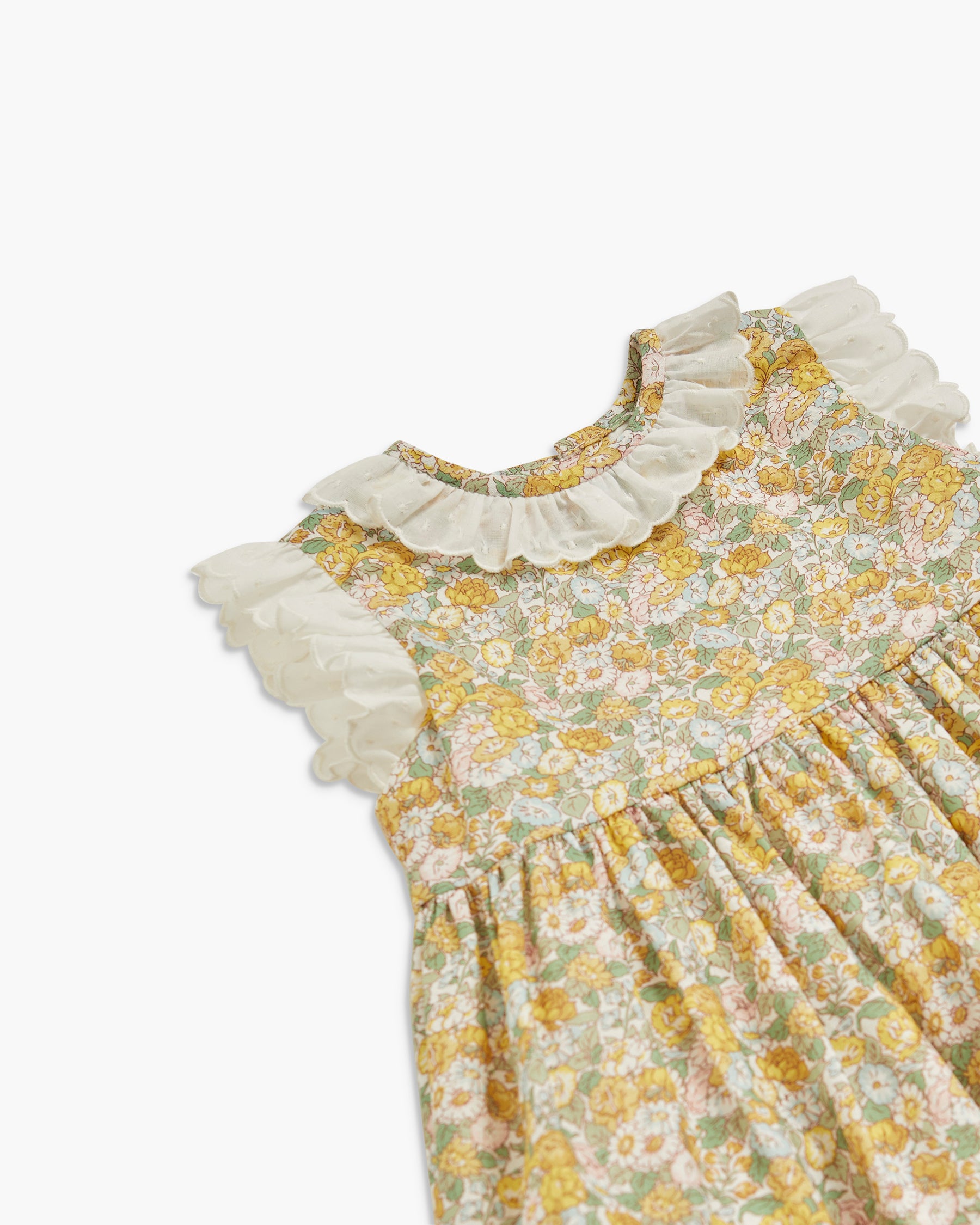 Floral dress with ruffled collar on a white background