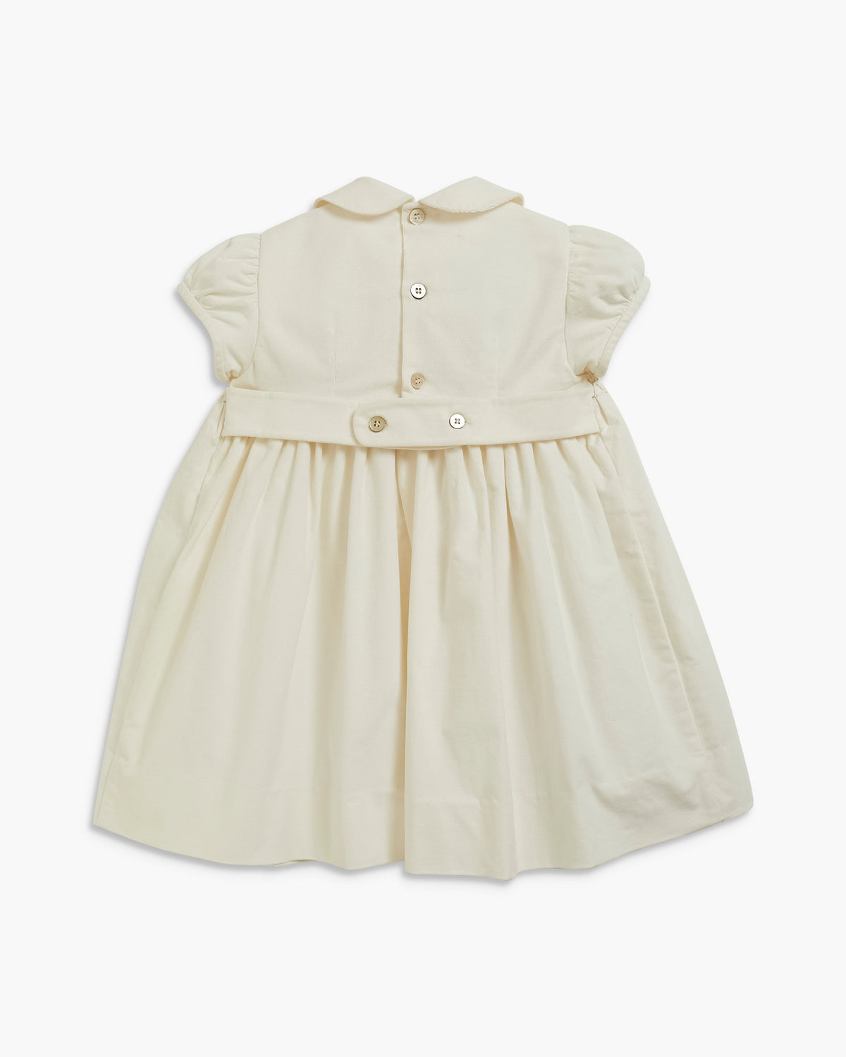A cream-colored baby dress with short puff sleeves, a Peter Pan collar, and a buttoned waist detail, shown against a plain white background.