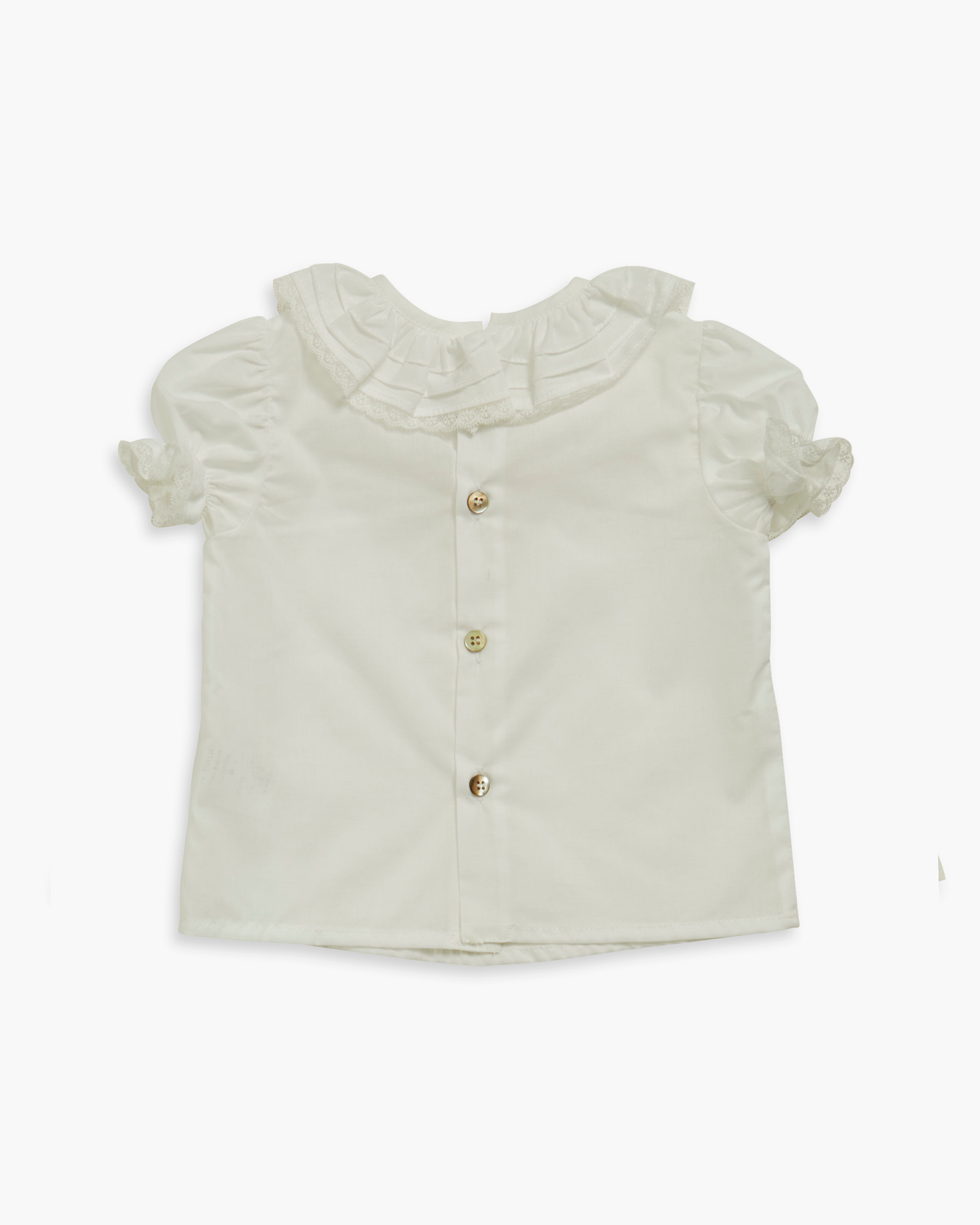 Light green blouse with ruffled details on a white background