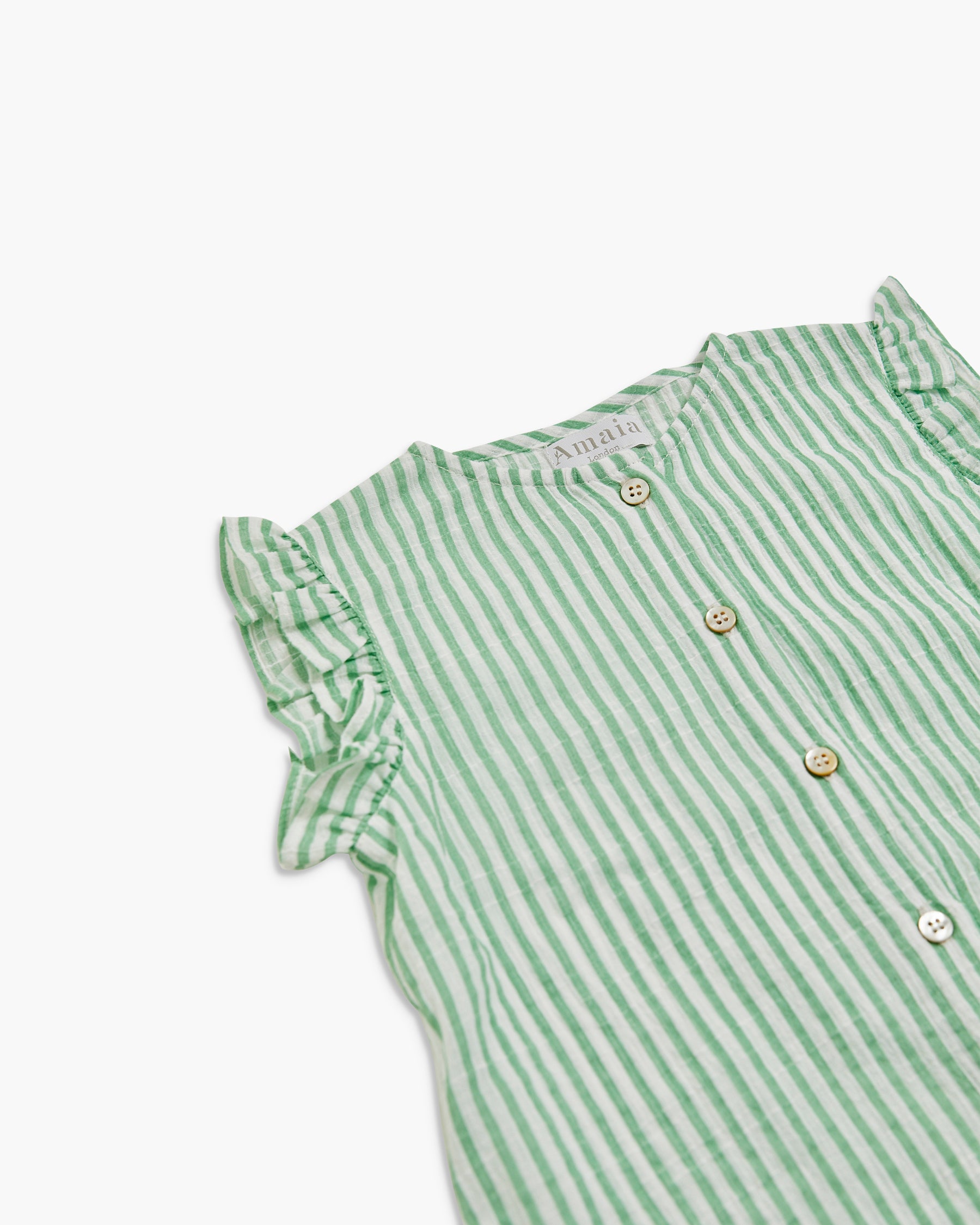 Green and white striped shirt with ruffled sleeves on a white background