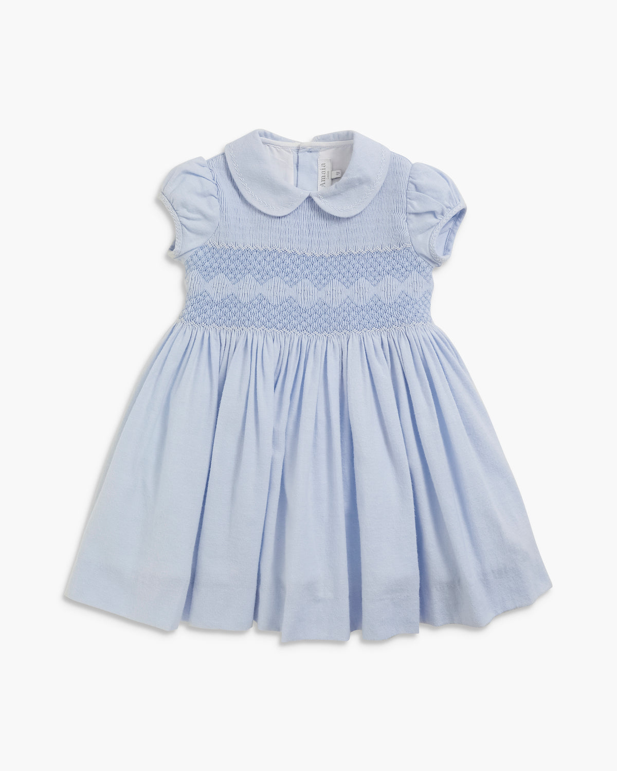 A light blue baby girl's dress featuring a Peter Pan collar, short puff sleeves, and a smocked bodice with a wavy pattern, set against a plain white background.