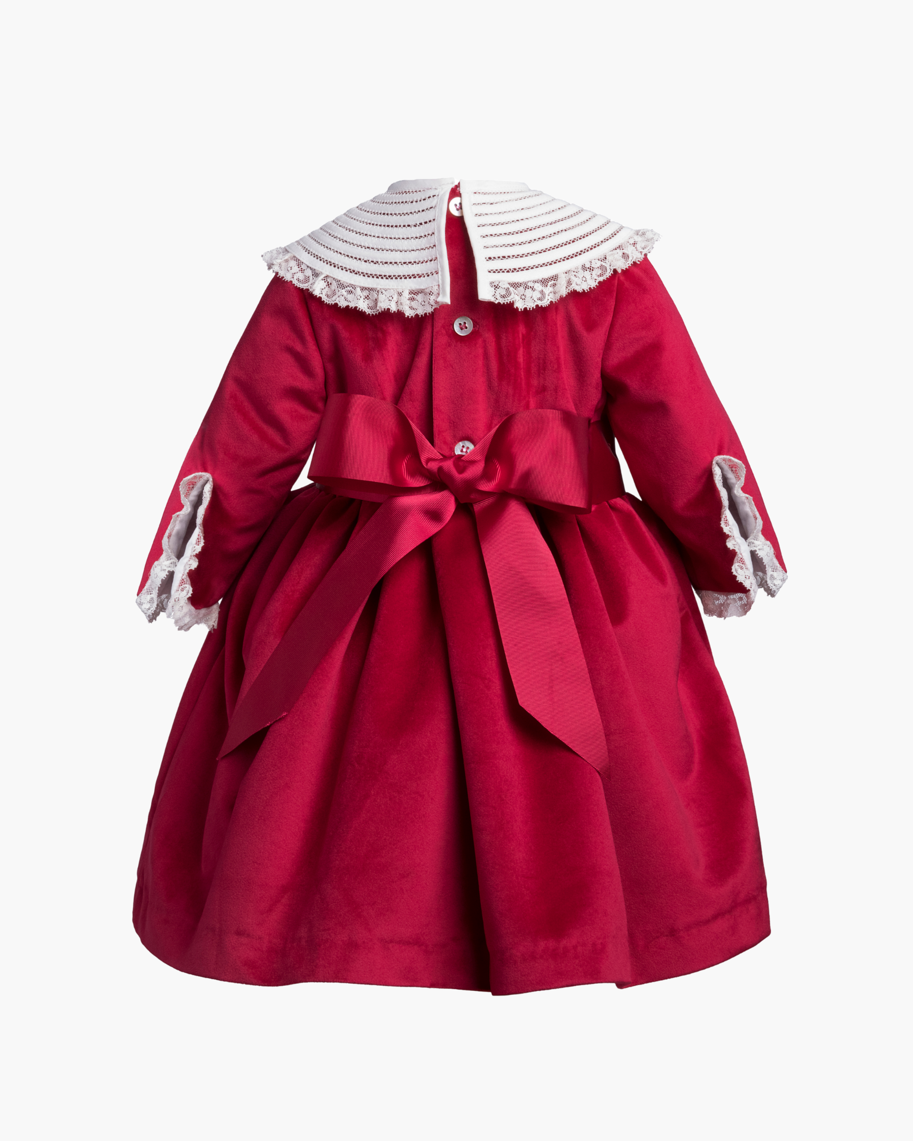 Red dress with white collar and cuffs on a white background