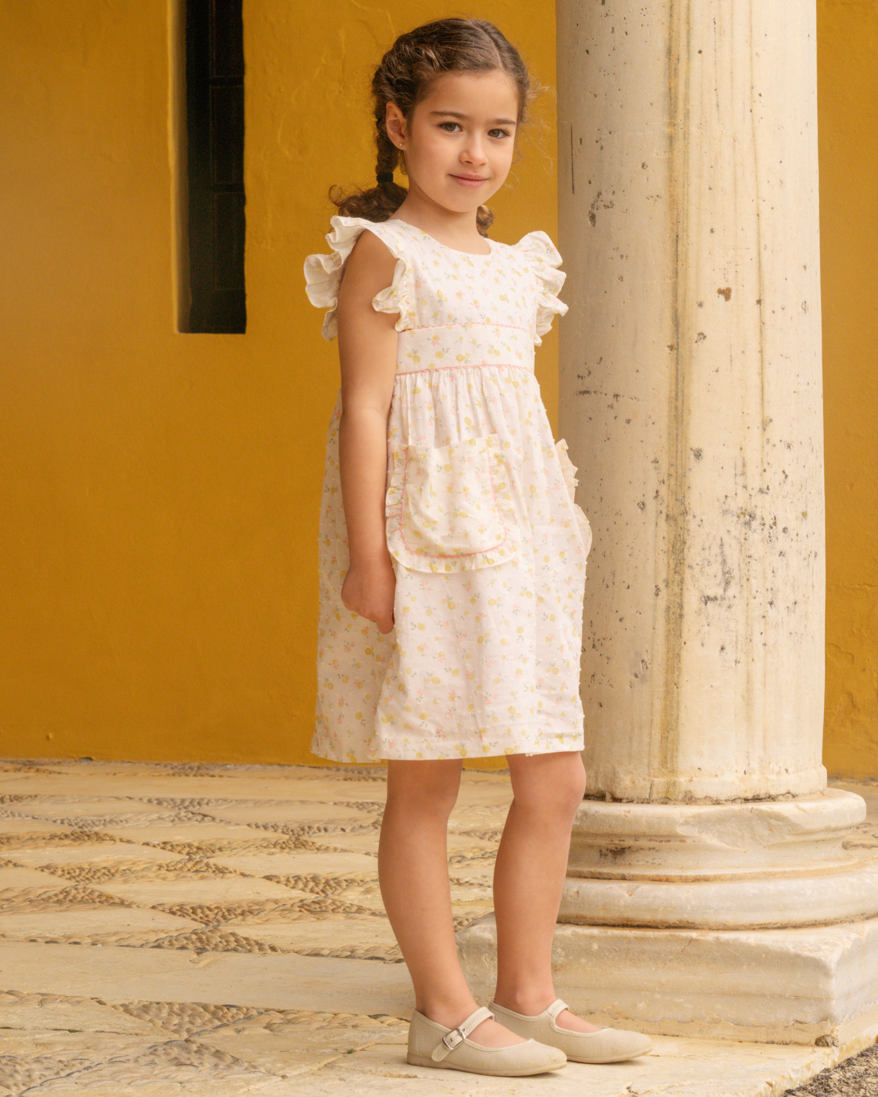 Young girl is wearing a floral dress