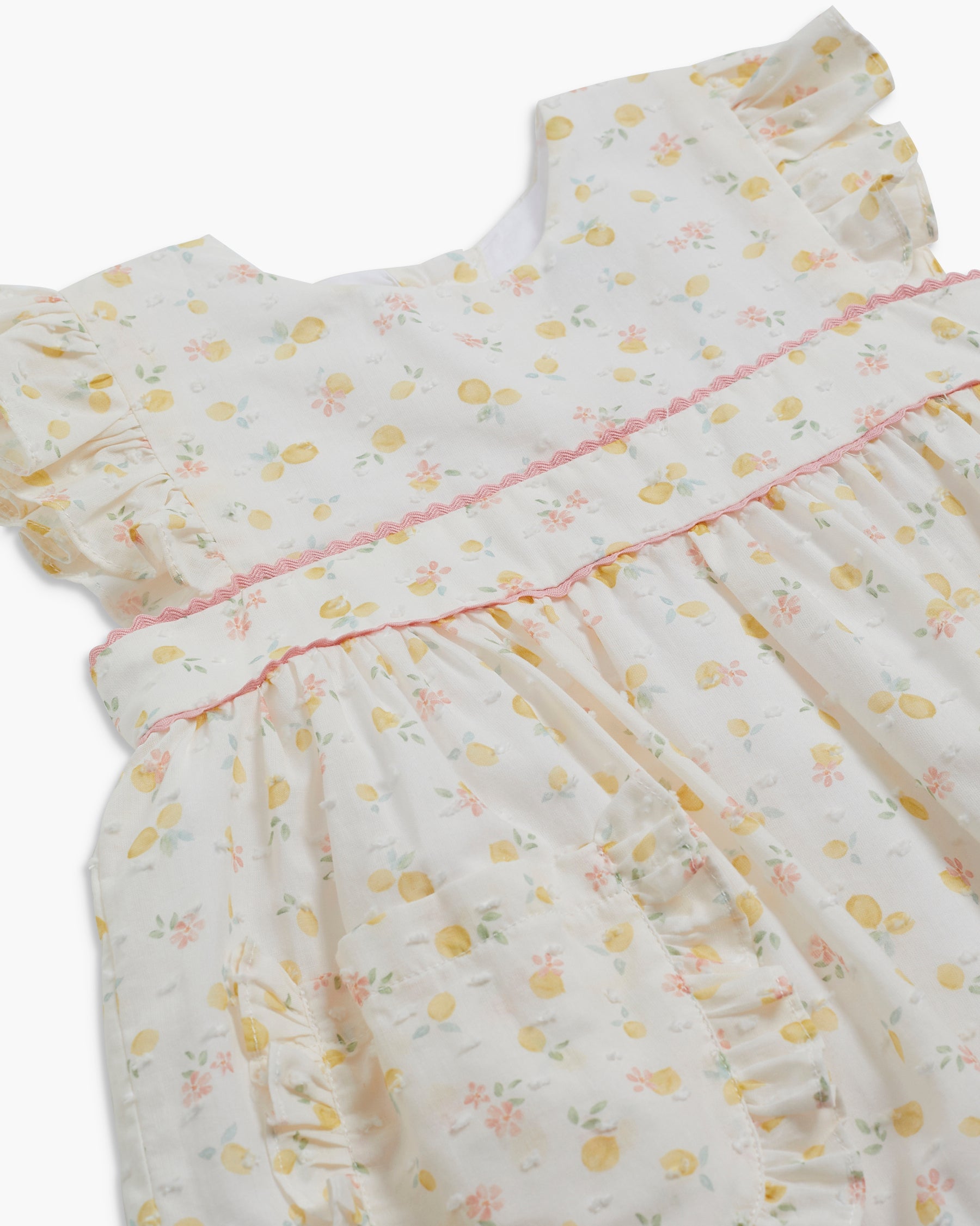 Floral dress with ruffled sleeves on a white background