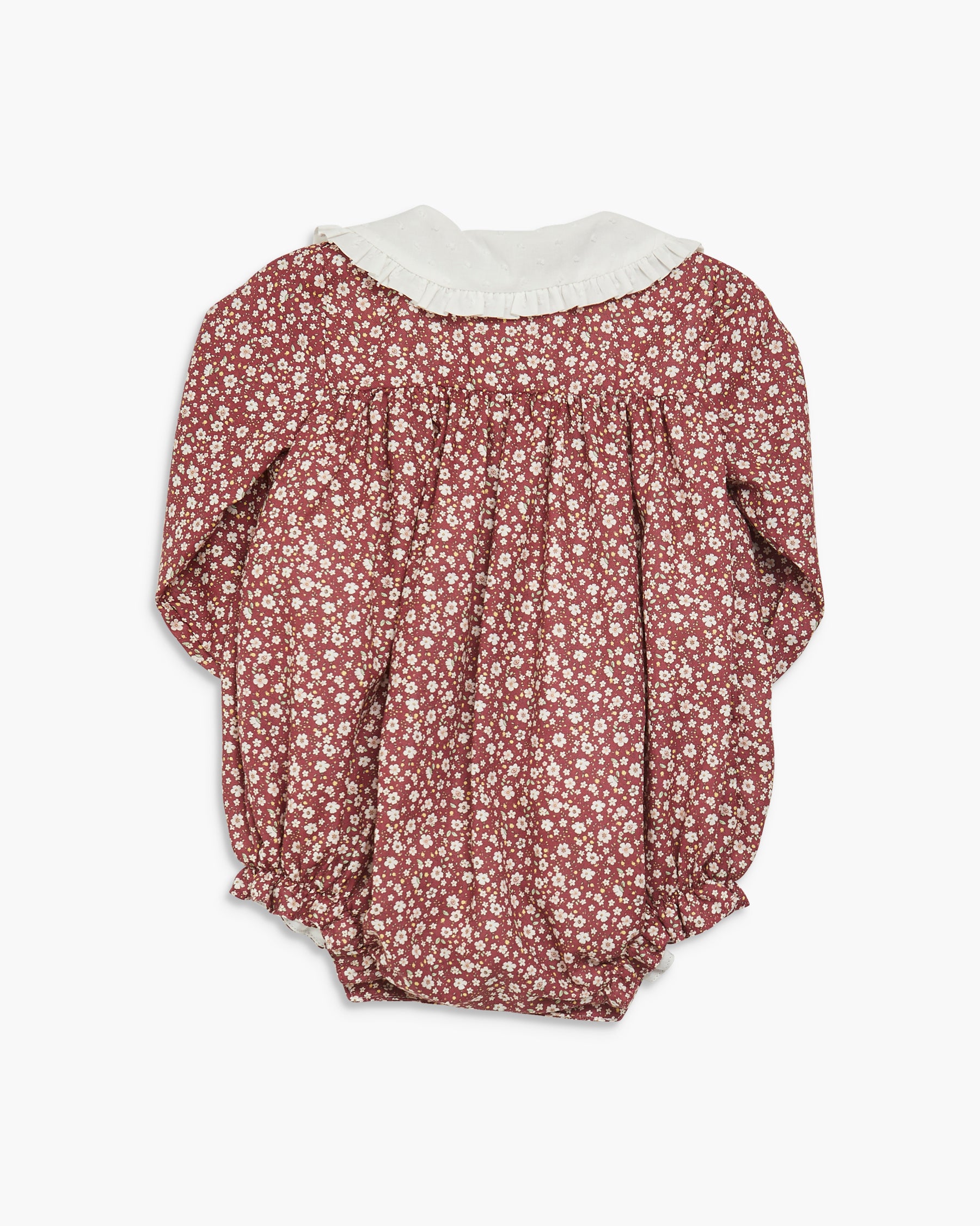 Floral baby romper with white collar on a white background