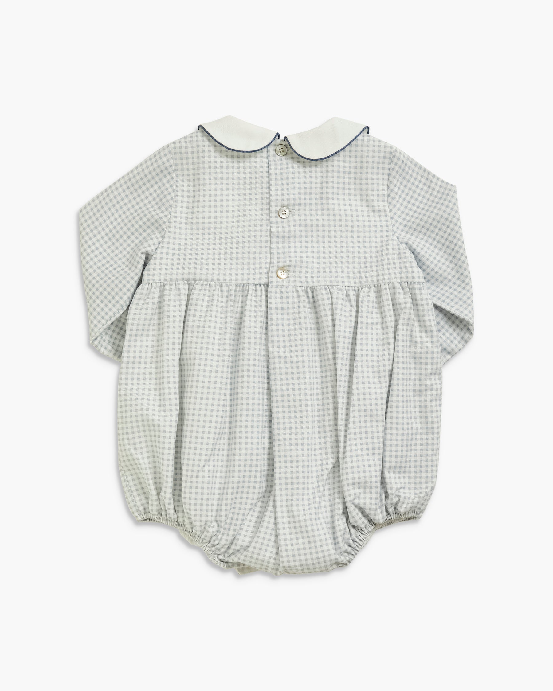 A baby long-sleeve romper in a light gray and white gingham pattern, featuring a white Peter Pan collar and three front buttons.