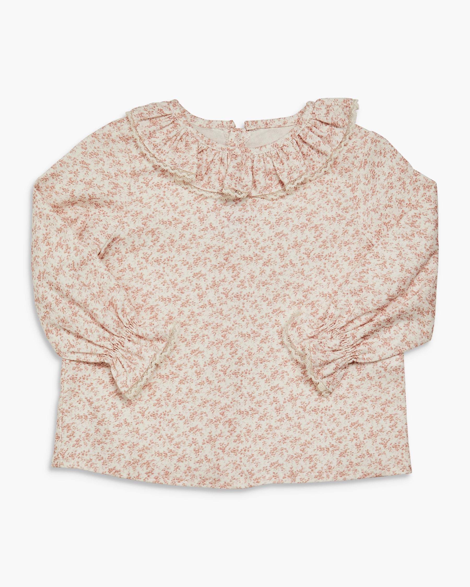 Floral blouse with ruffled collar on a white background