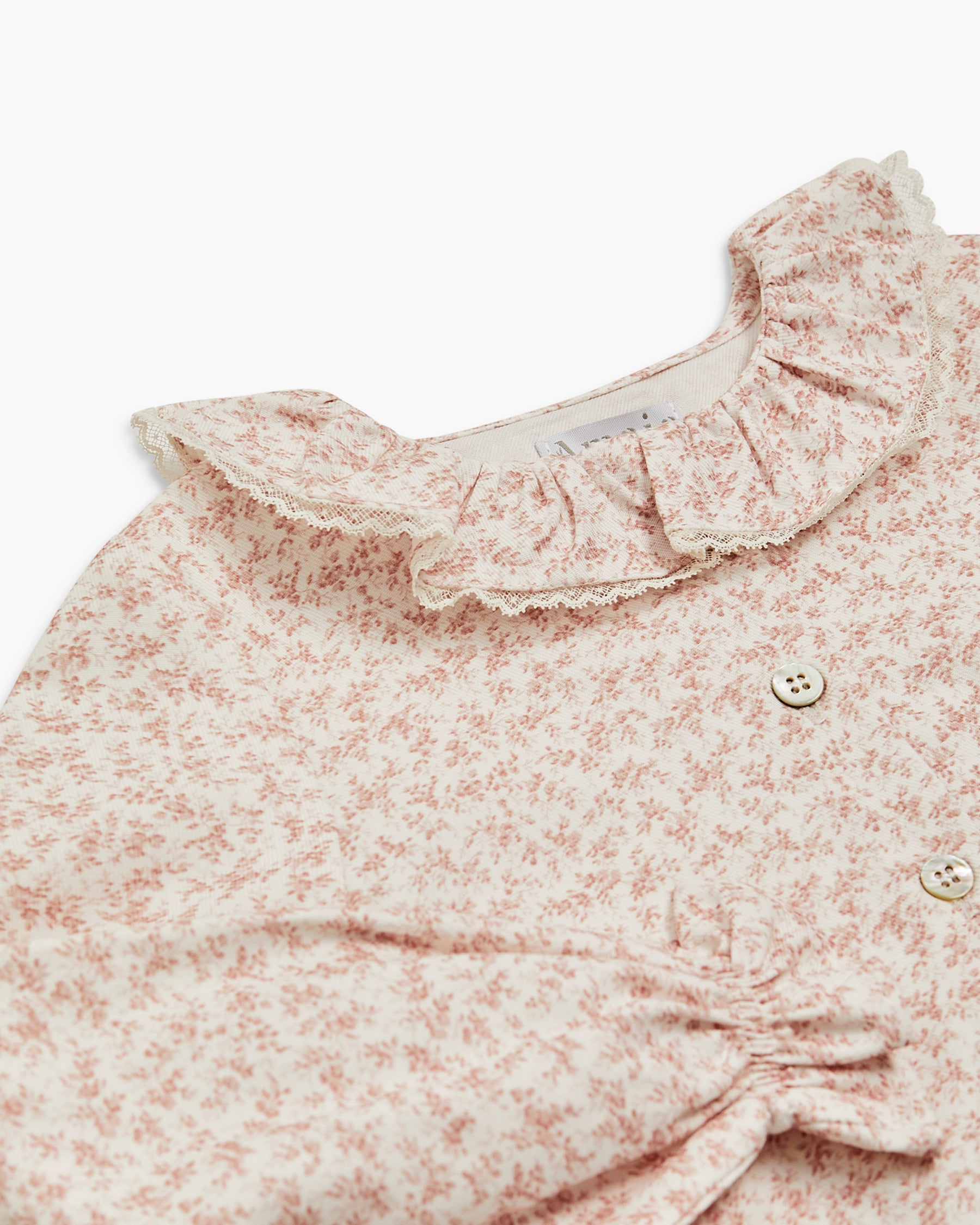 Floral patterned blouse on a white background