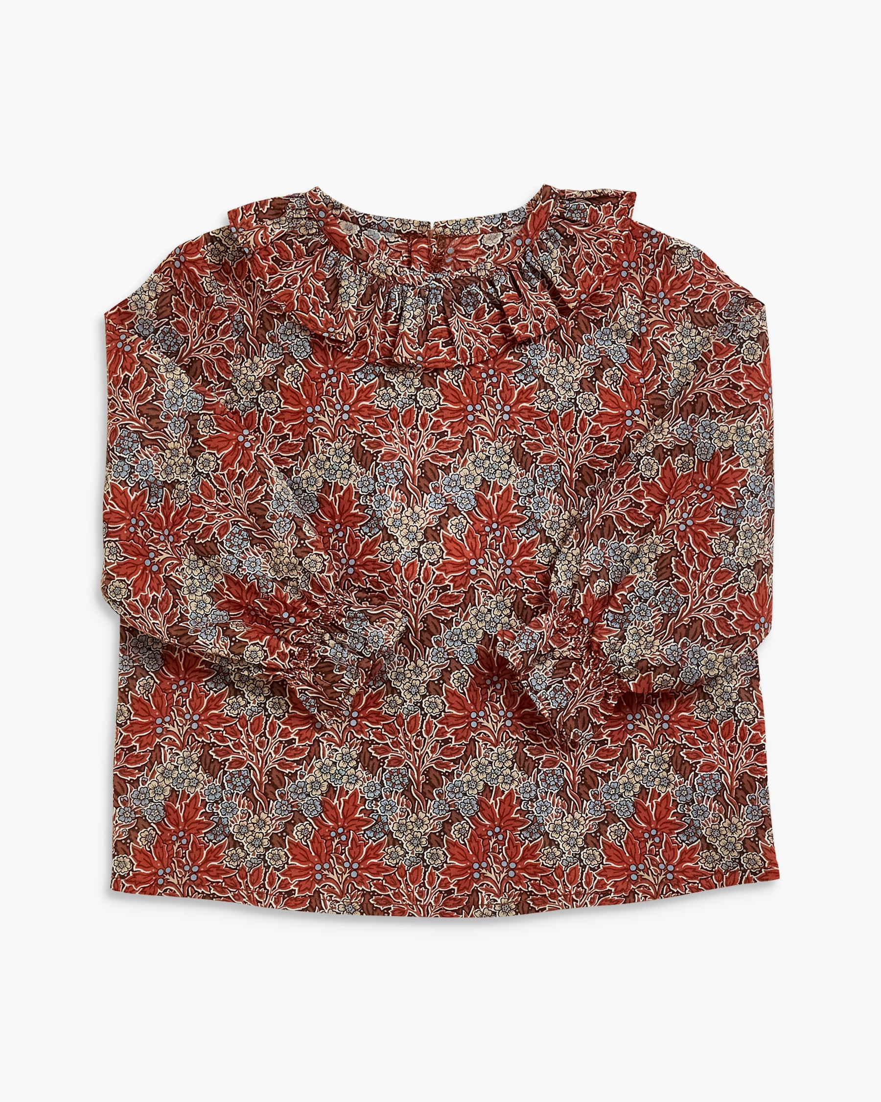 A long-sleeve blouse with a ruffled neckline, featuring an all-over floral pattern in rust red, gray, and white.