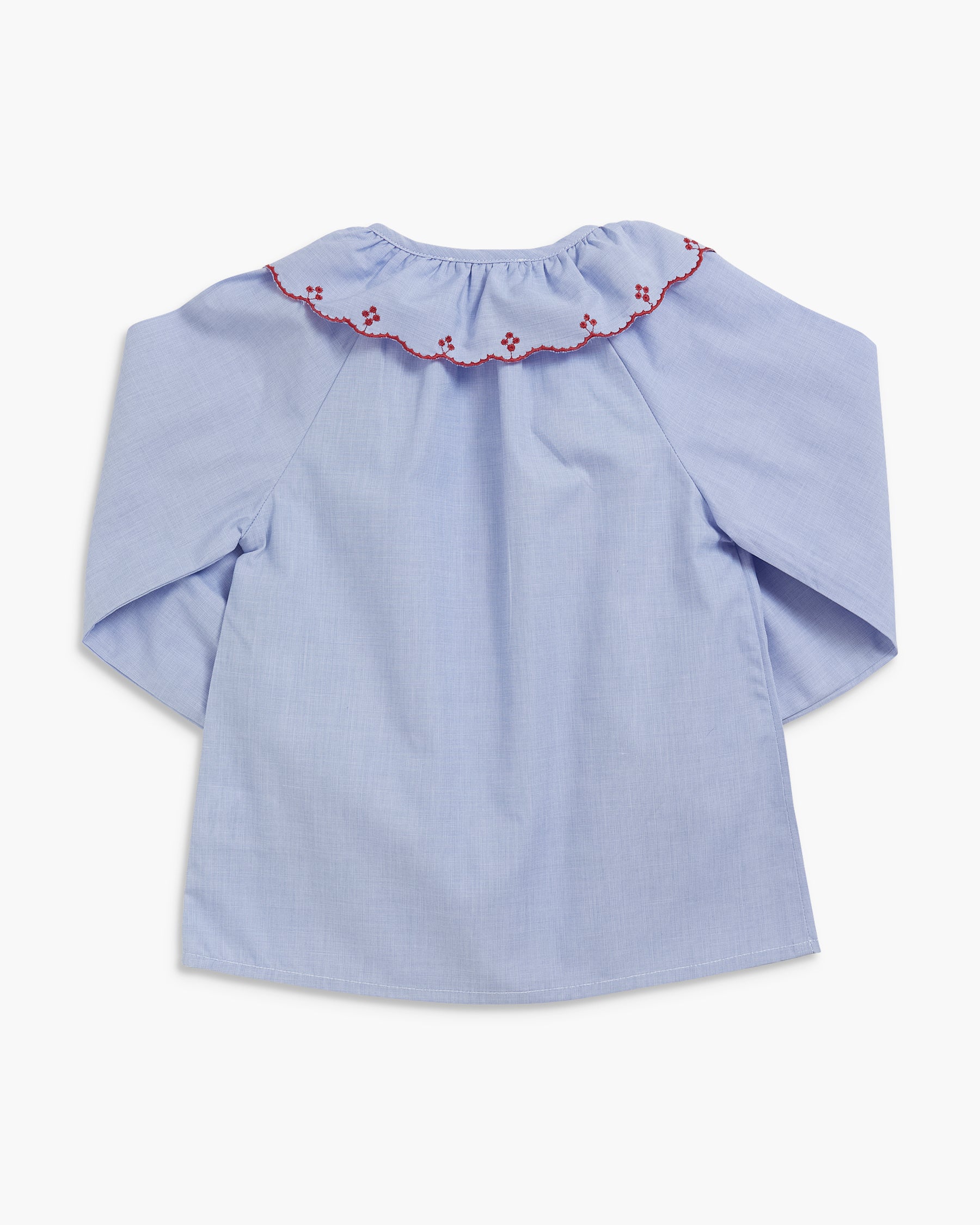 A light blue long-sleeve blouse with a ruffled collar featuring small red embroidered floral details, shown against a plain white background.