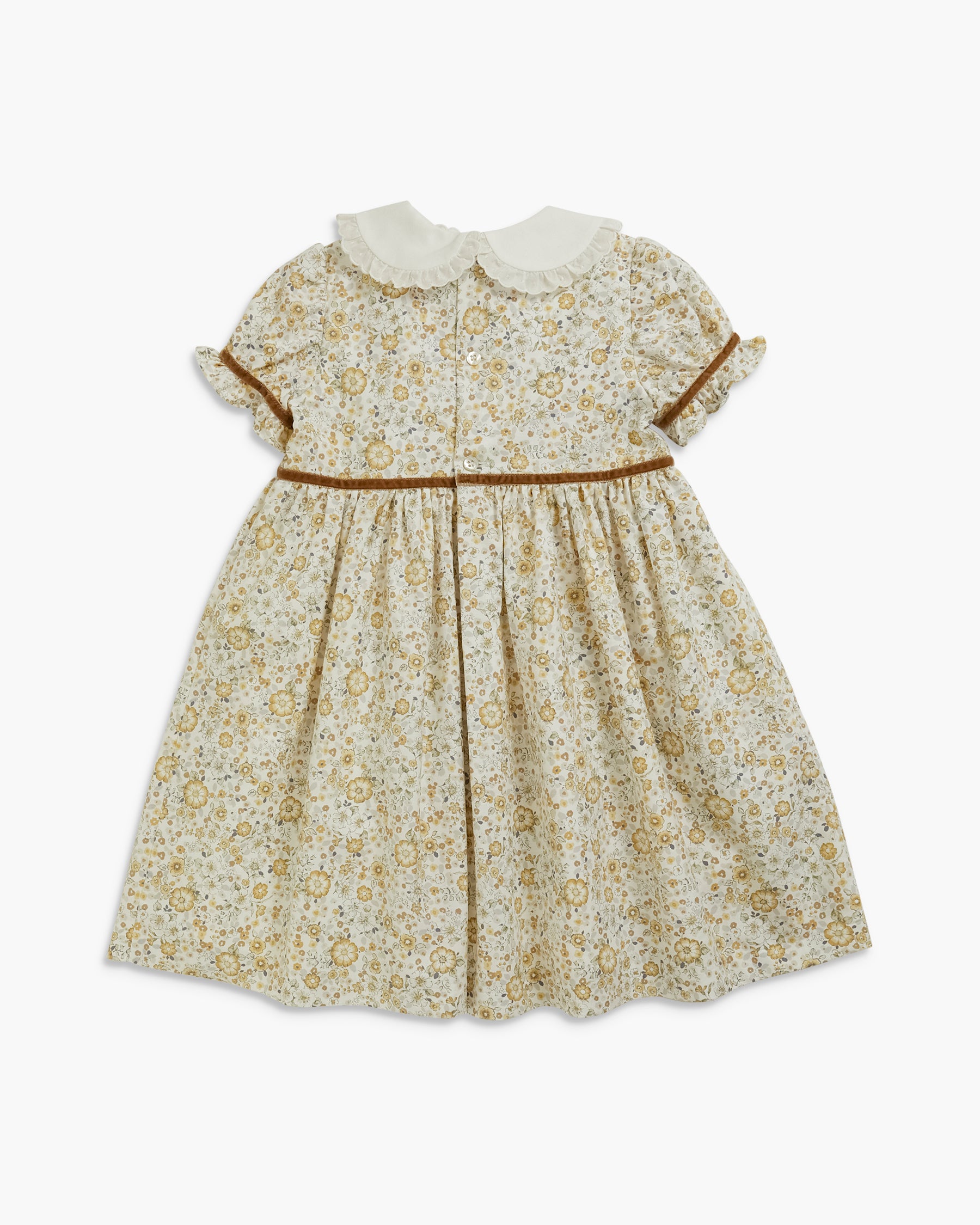A toddler girl's short-sleeve dress with a cream-colored Peter Pan collar, featuring a beige and brown floral print, a thin brown waistband, and ruffled sleeves, shown against a plain light gray background.