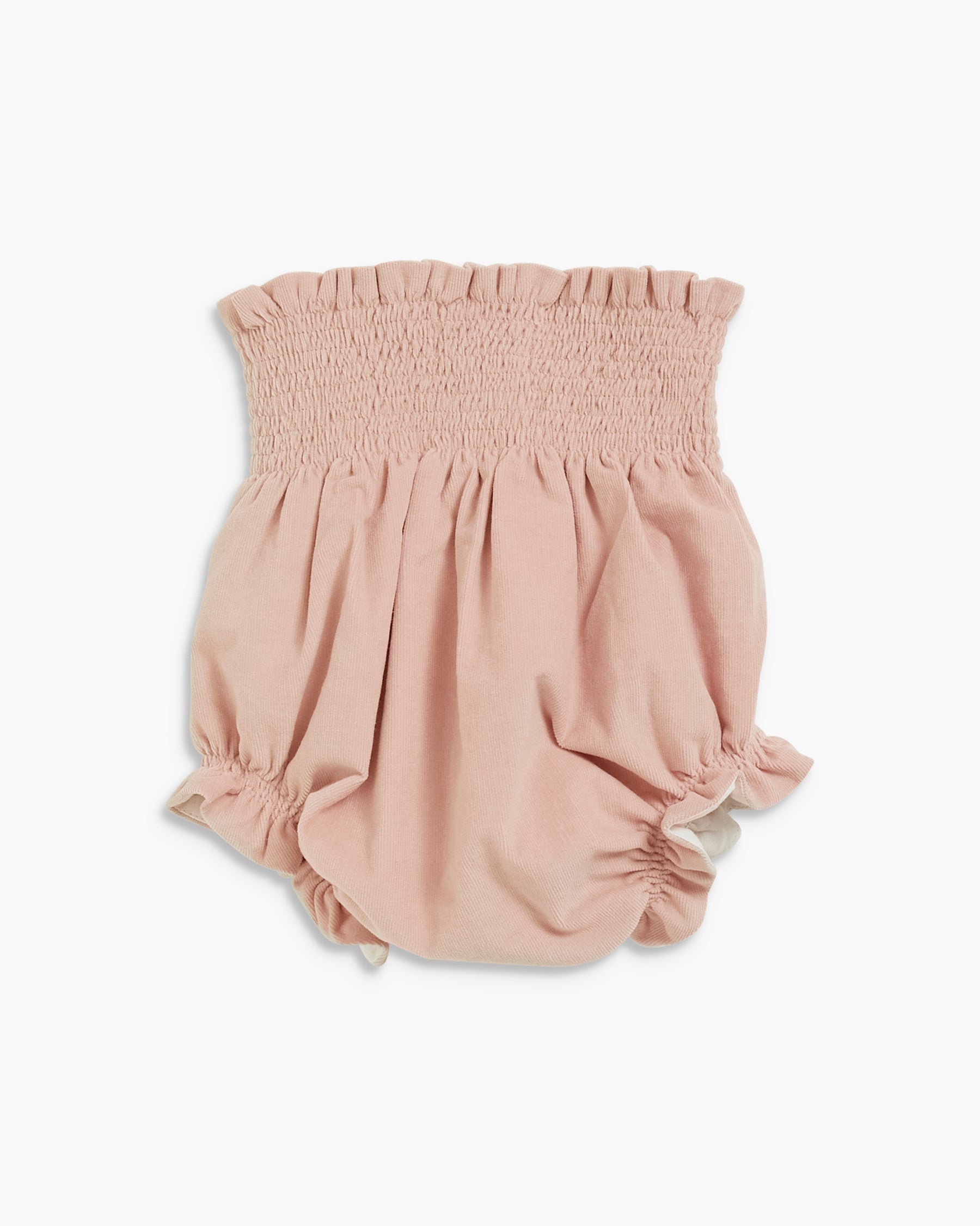 A baby romper in a dusty rose pink color, featuring a smocked elastic waistband and gathered ruffle details at the legs, shown against a plain white background.